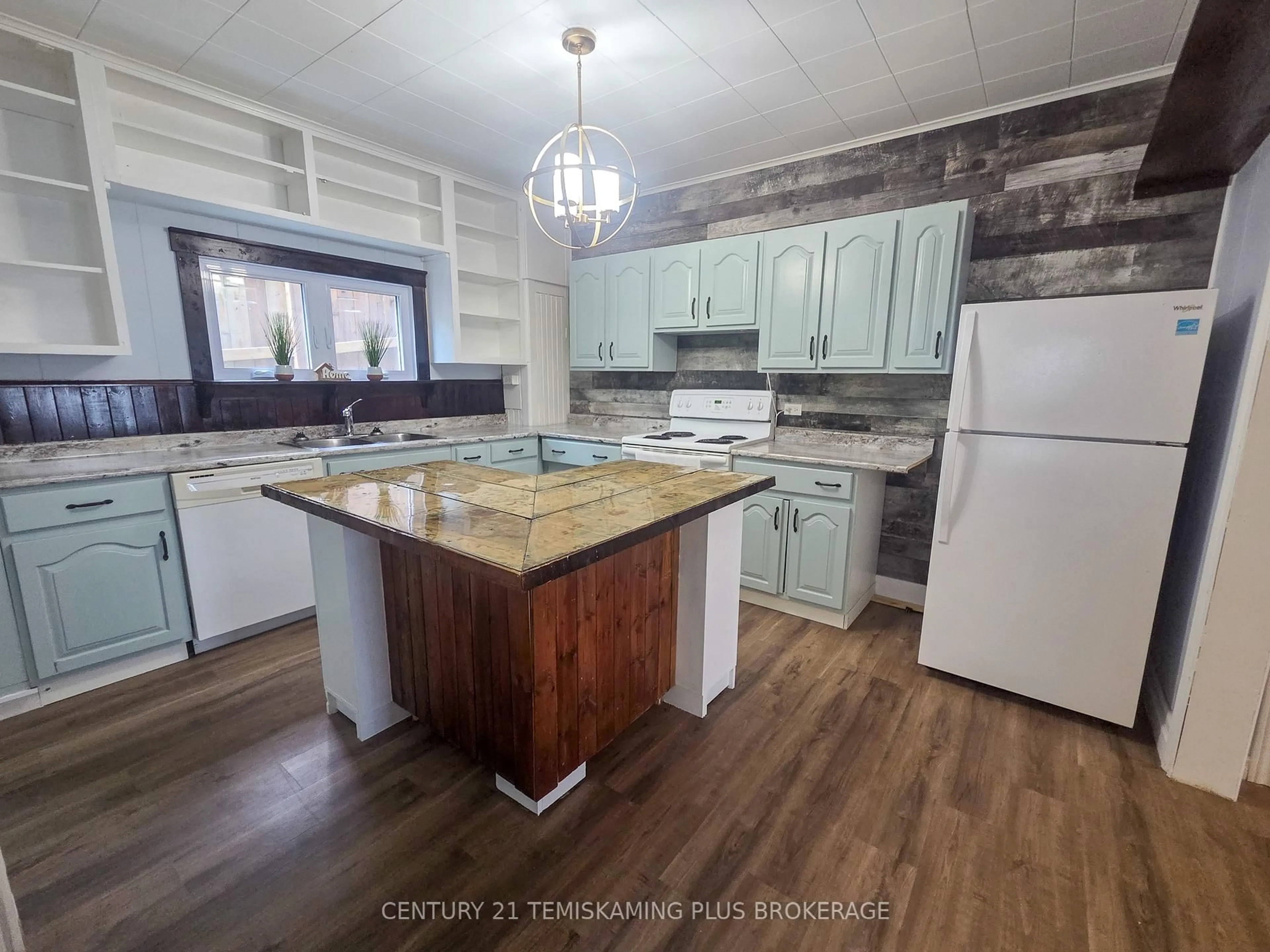 Open concept kitchen, wood/laminate floor for 24 Baker St, Cobalt Ontario P0J 1C0