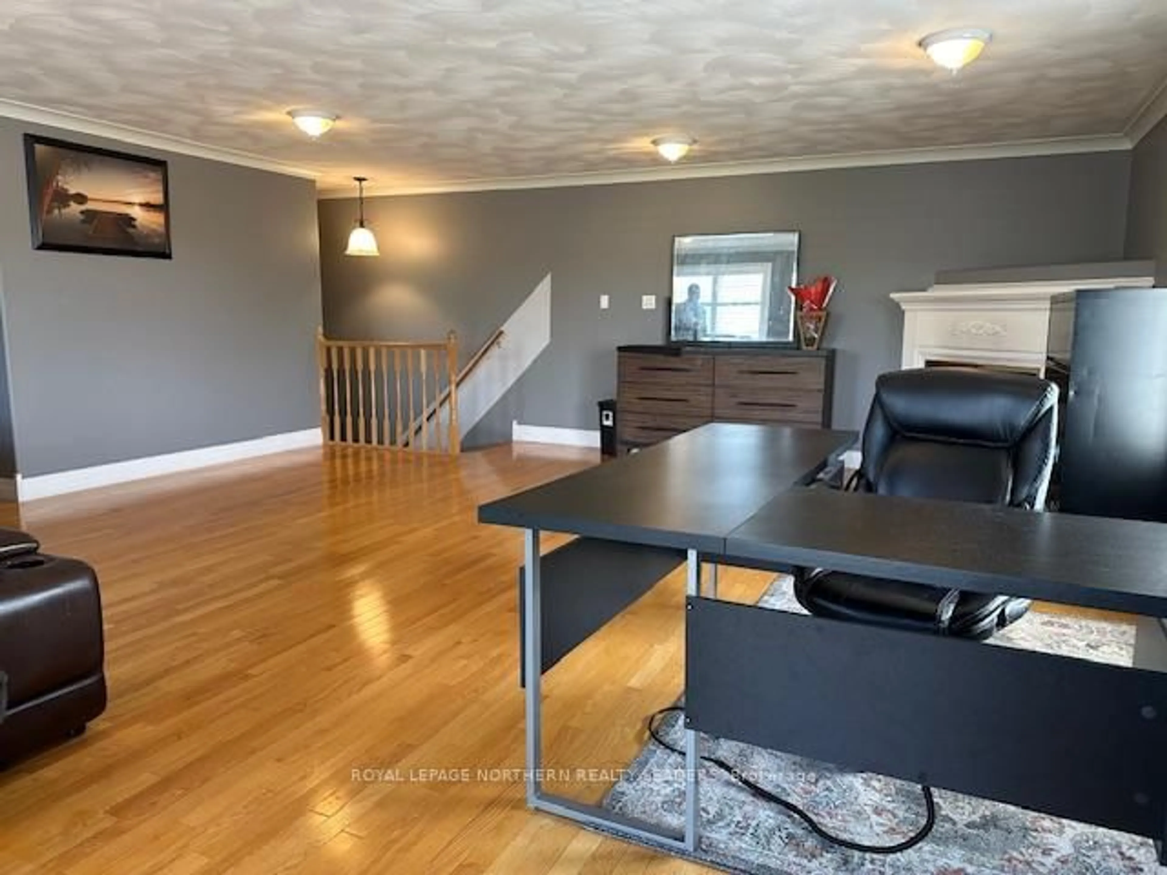Living room with furniture, wood/laminate floor for 270 Waterloo Rd, Timmins Ontario P4N 4Y1