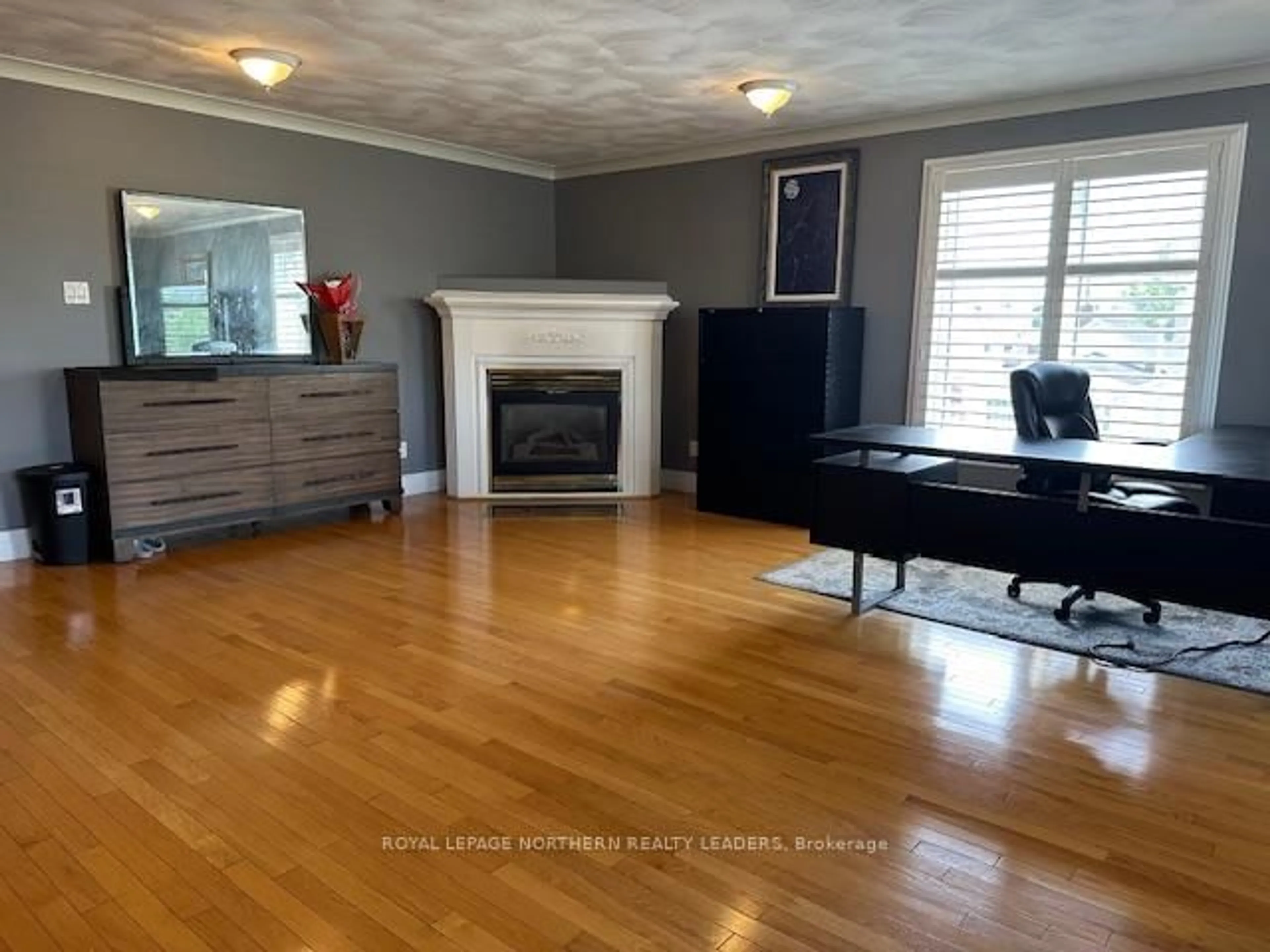 Living room with furniture, wood/laminate floor for 270 Waterloo Rd, Timmins Ontario P4N 4Y1