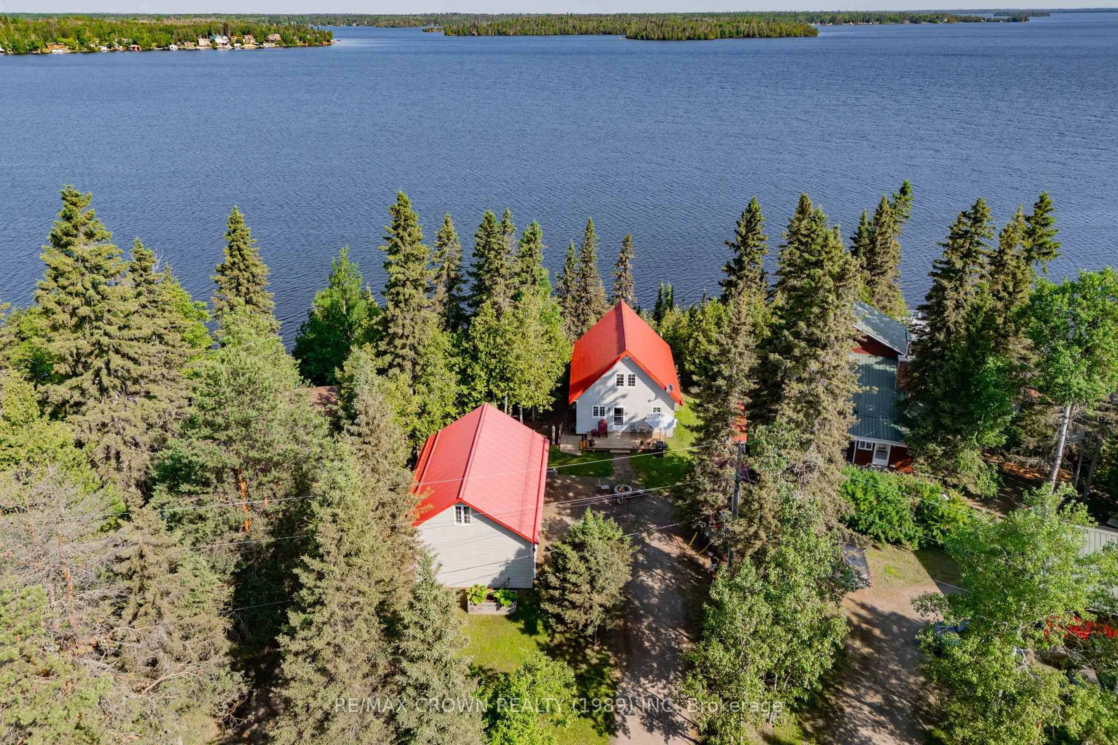 A pic from outside/outdoor area/front of a property/back of a property/a pic from drone, water/lake/river/ocean view for 33 Sailing Club Rd #Moonbeam, Kapuskasing Ontario P0L 1V0