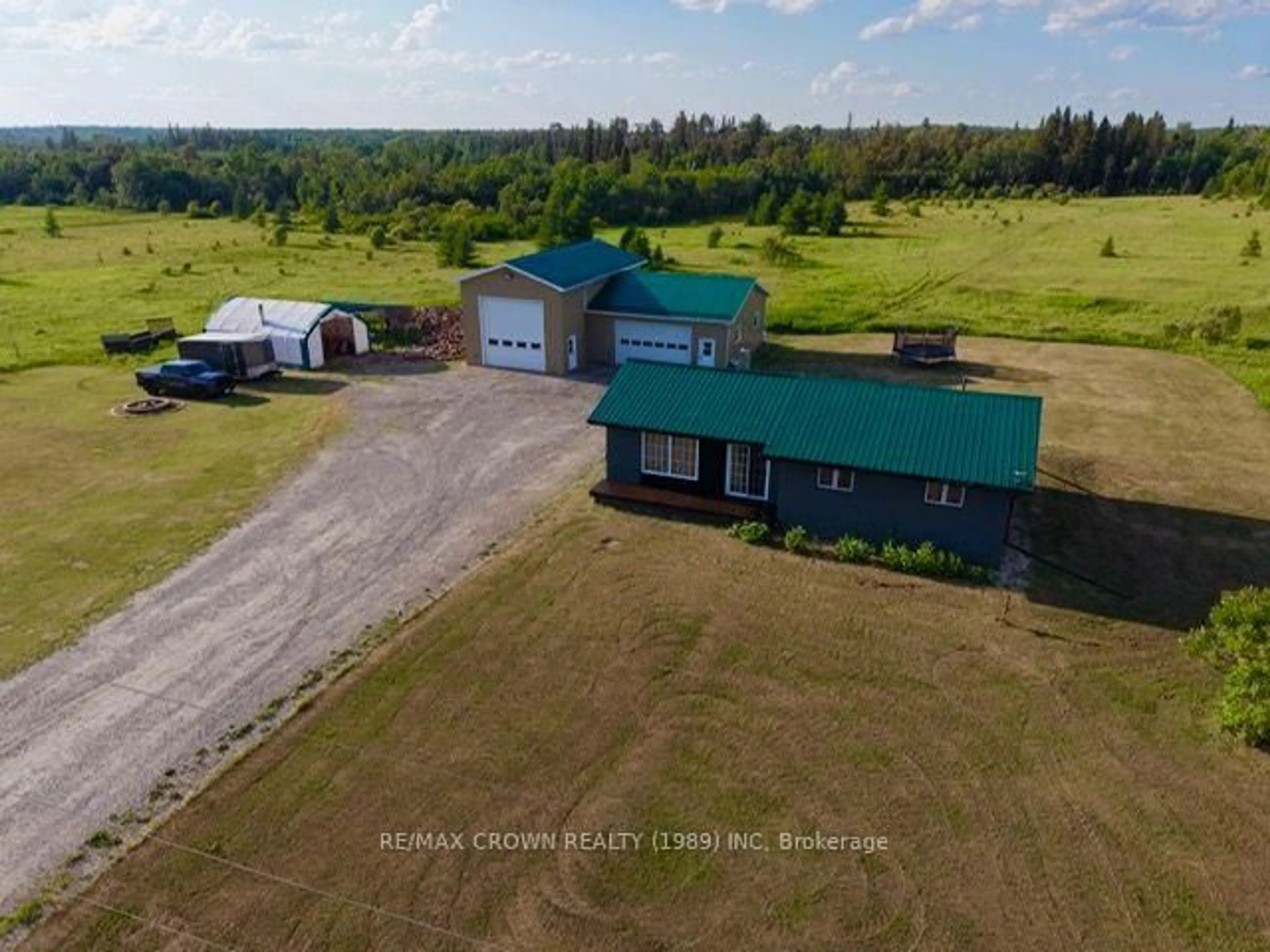 A pic from outside/outdoor area/front of a property/back of a property/a pic from drone, building for 198 HIGHWAY 11 Highway, Kapuskasing Ontario P5N 2G0