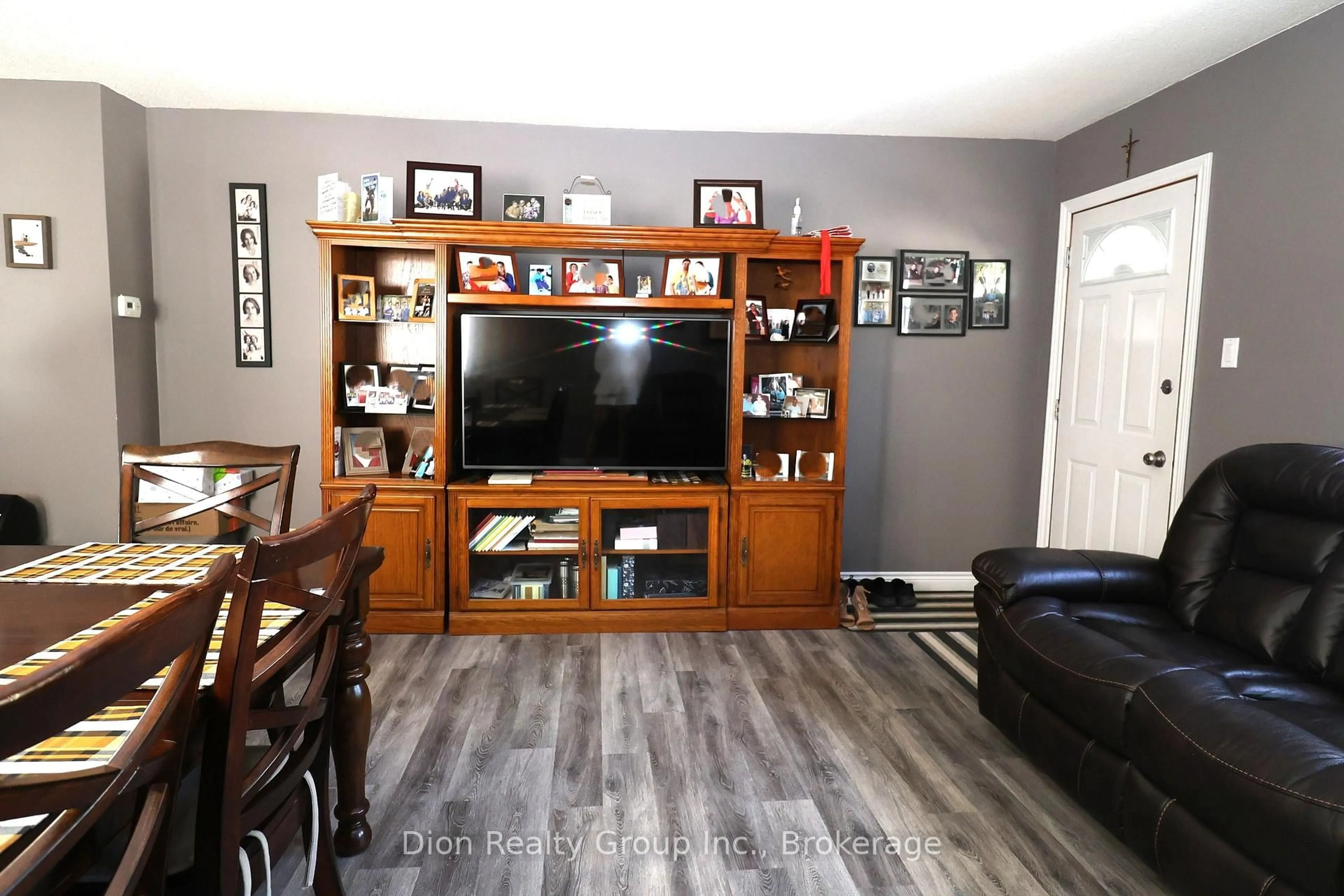 Living room with furniture, wood/laminate floor for 765 Government Rd, Kirkland Lake Ontario P0K 1A0