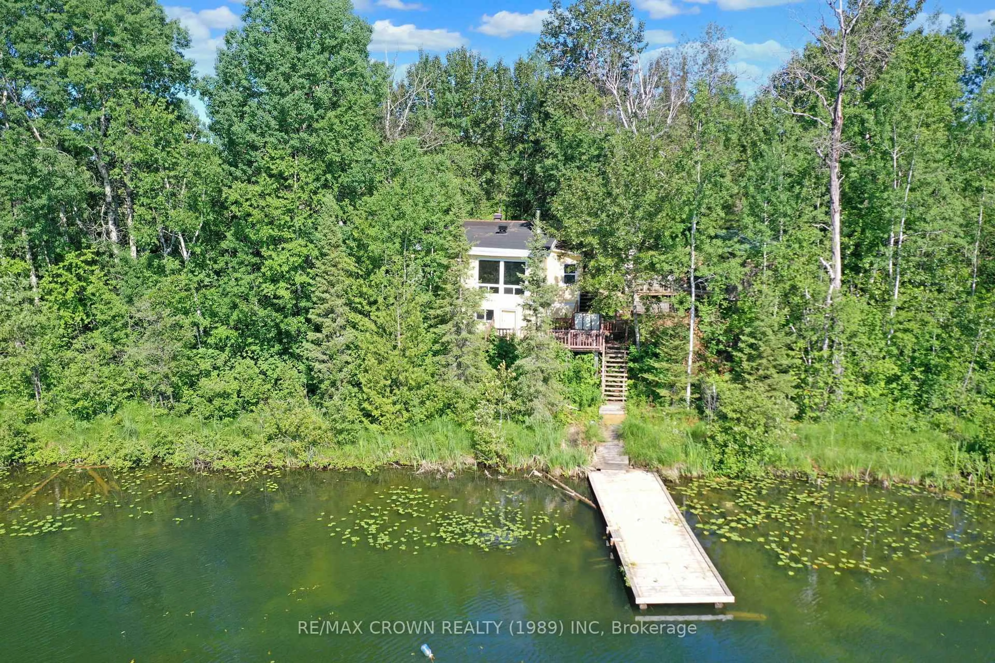 A pic from outside/outdoor area/front of a property/back of a property/a pic from drone, water/lake/river/ocean view for 22 Chain Of Lakes Rd #Moonbeam, Kapuskasing Ontario P0L 1V0