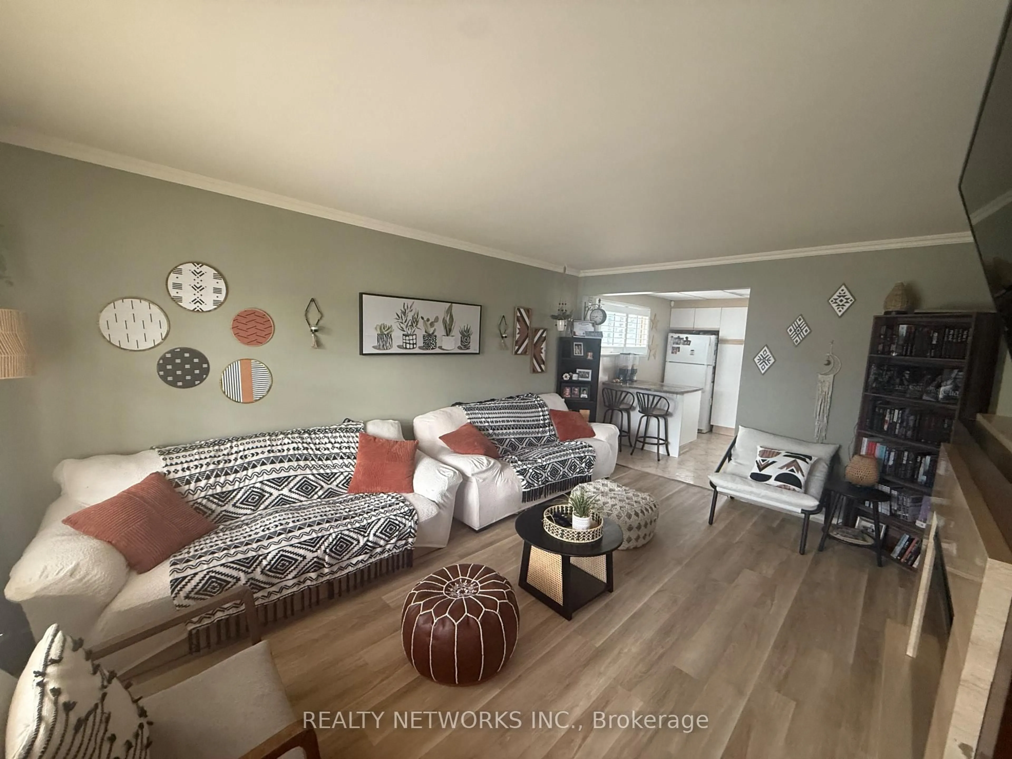 Living room with furniture, wood/laminate floor for 556 Maple St, Timmins Ontario P4N 2A3