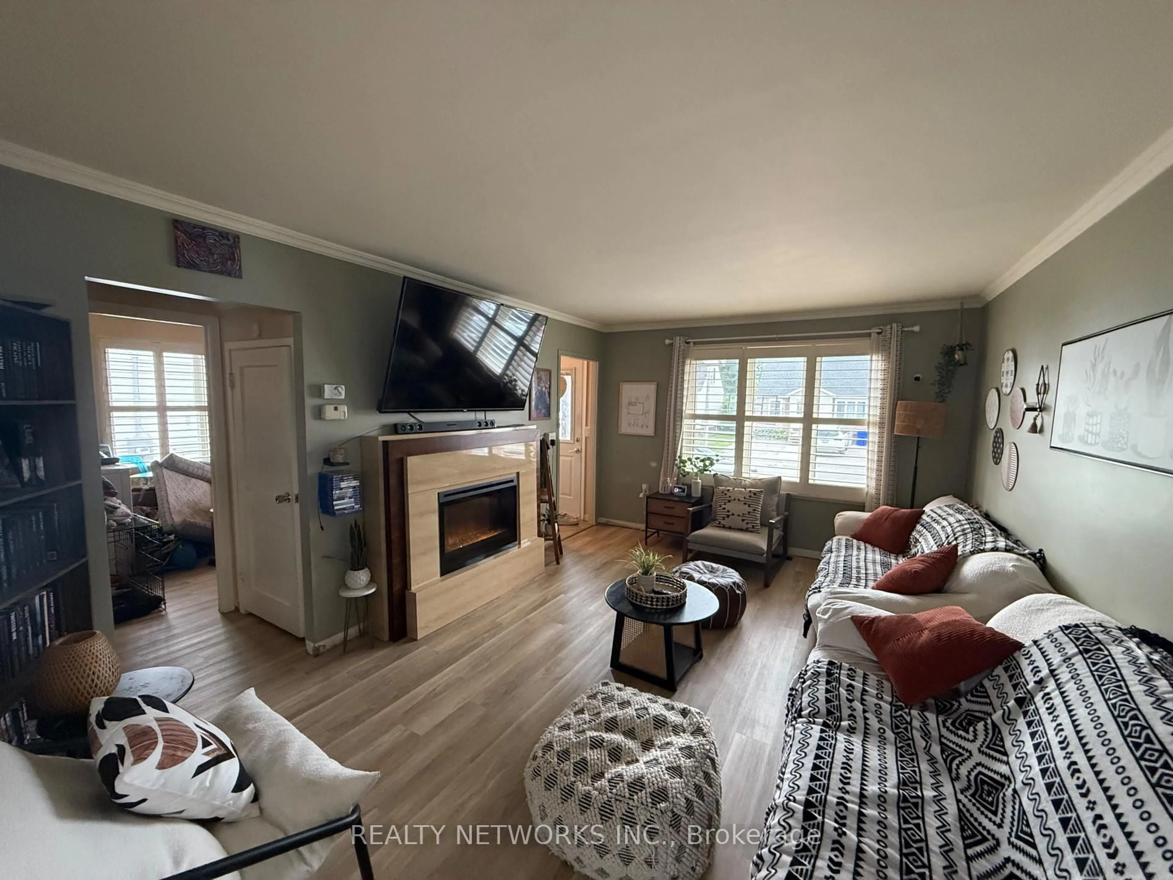 Living room with furniture, wood/laminate floor for 556 Maple St, Timmins Ontario P4N 2A3