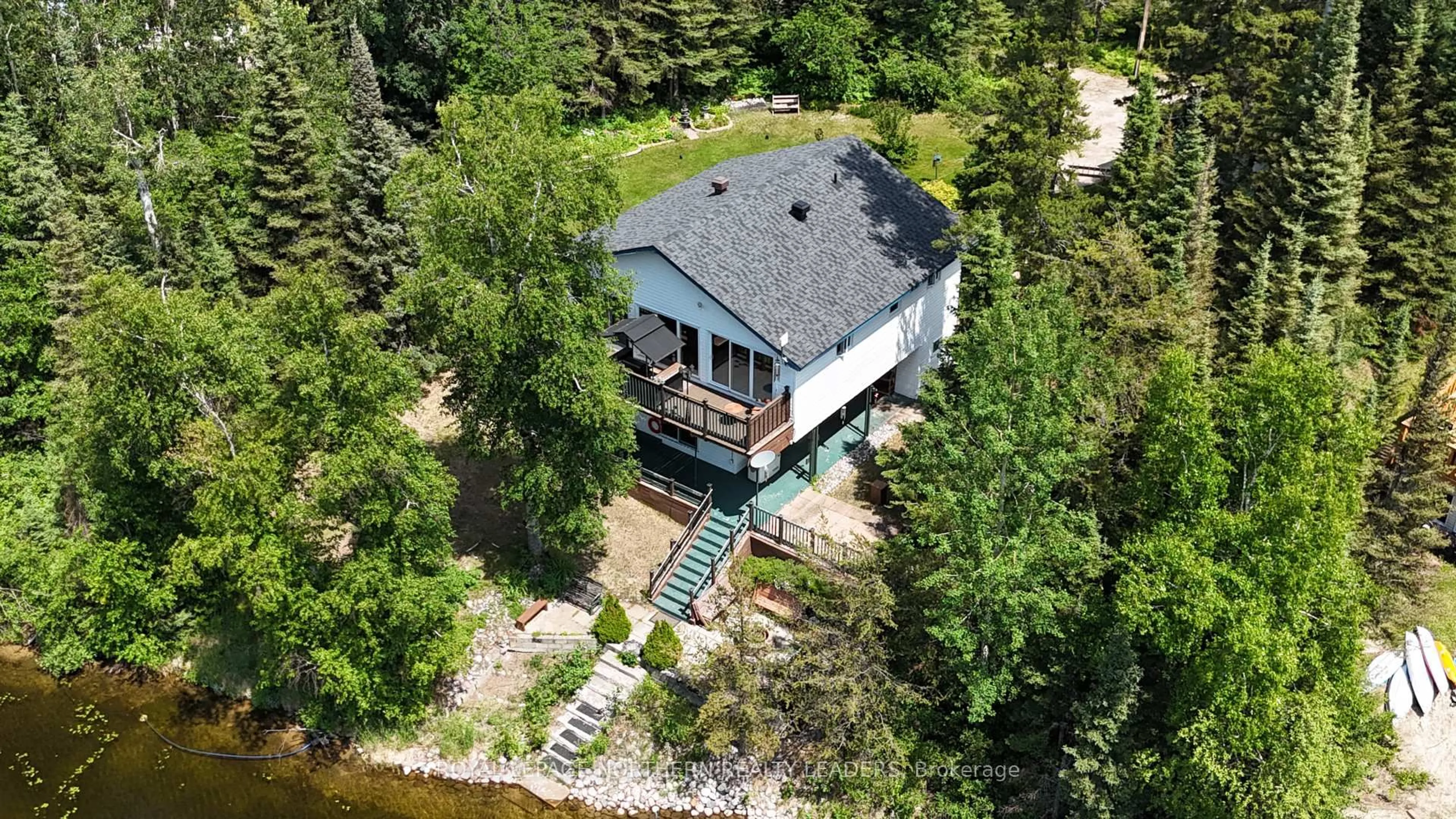 A pic from outside/outdoor area/front of a property/back of a property/a pic from drone, water/lake/river/ocean view for 1143 Douglas Rd, Iroquois Falls Ontario P0K 1G0