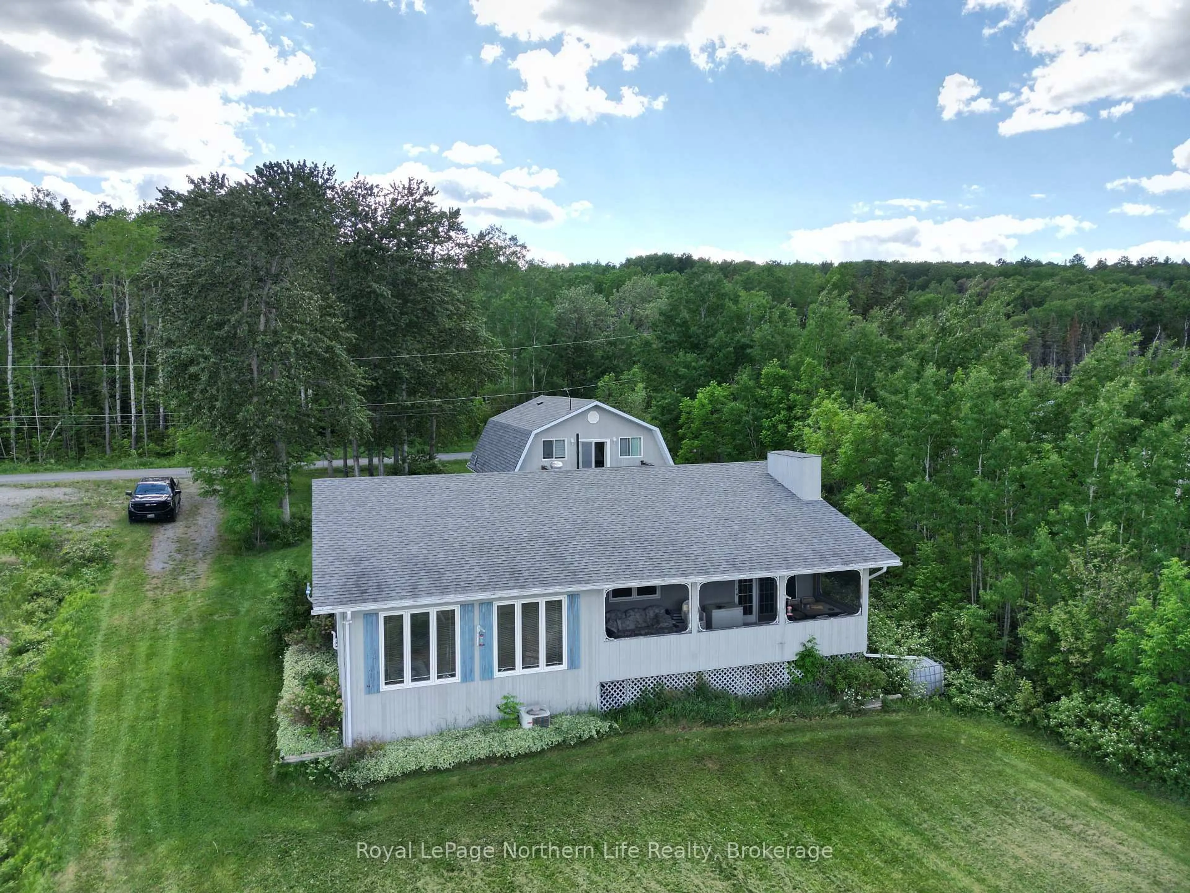 A pic from outside/outdoor area/front of a property/back of a property/a pic from drone, building for 501182 Berry Rd, Timiskaming Ontario P0J 1R0