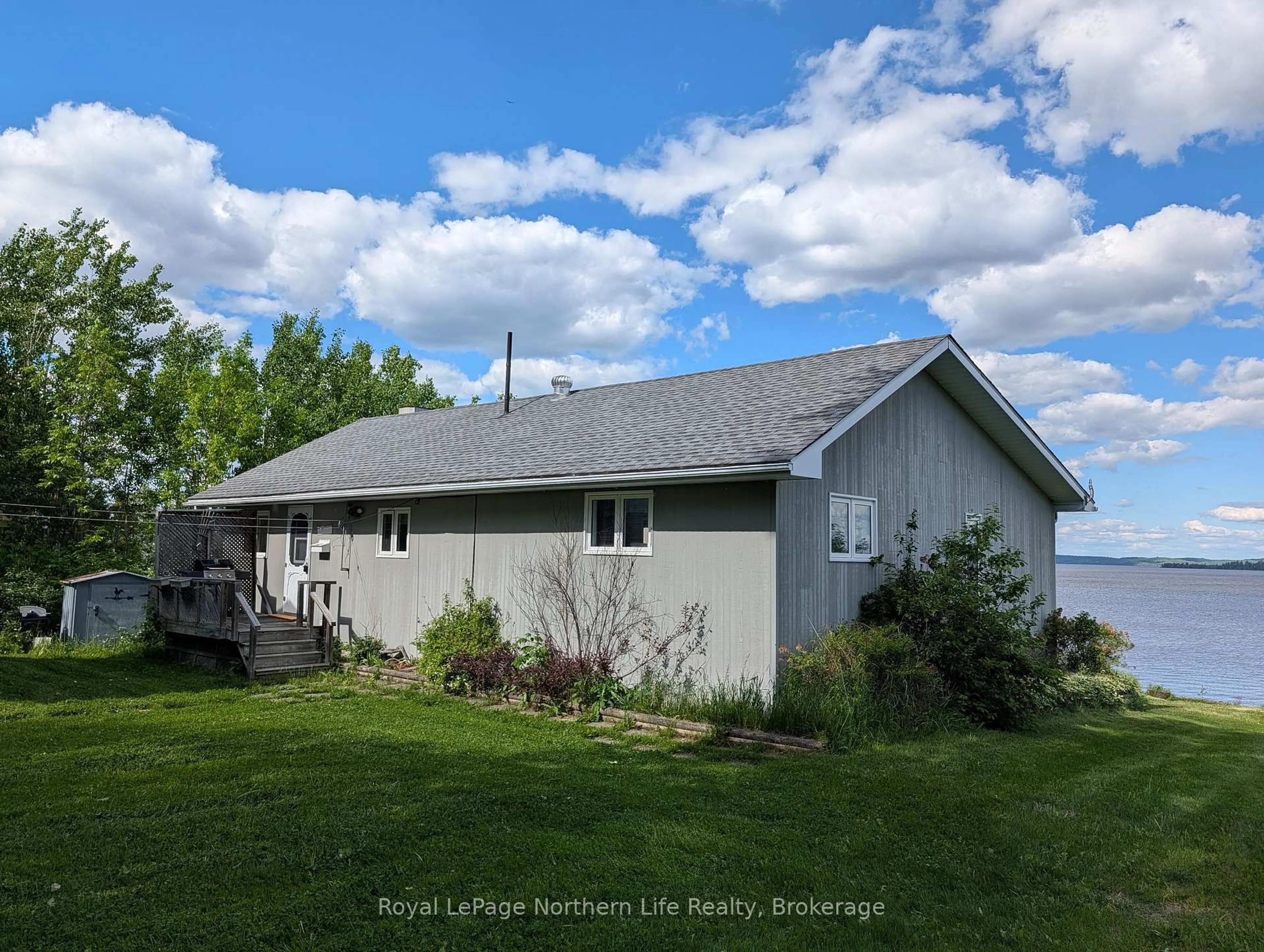 A pic from outside/outdoor area/front of a property/back of a property/a pic from drone, water/lake/river/ocean view for 501182 Berry Rd, Timiskaming Ontario P0J 1R0