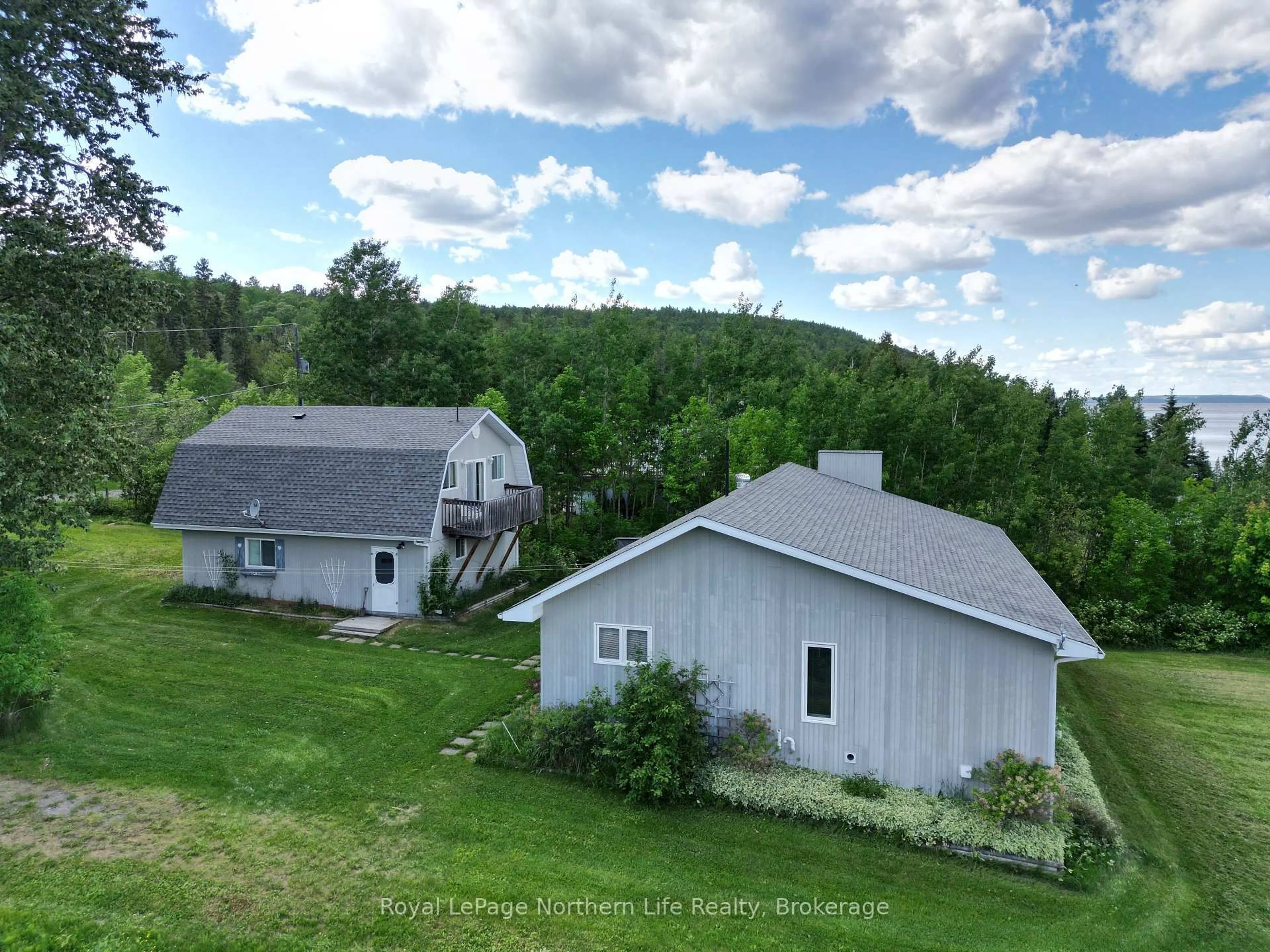 A pic from outside/outdoor area/front of a property/back of a property/a pic from drone, mountain view for 501182 Berry Rd, Timiskaming Ontario P0J 1R0