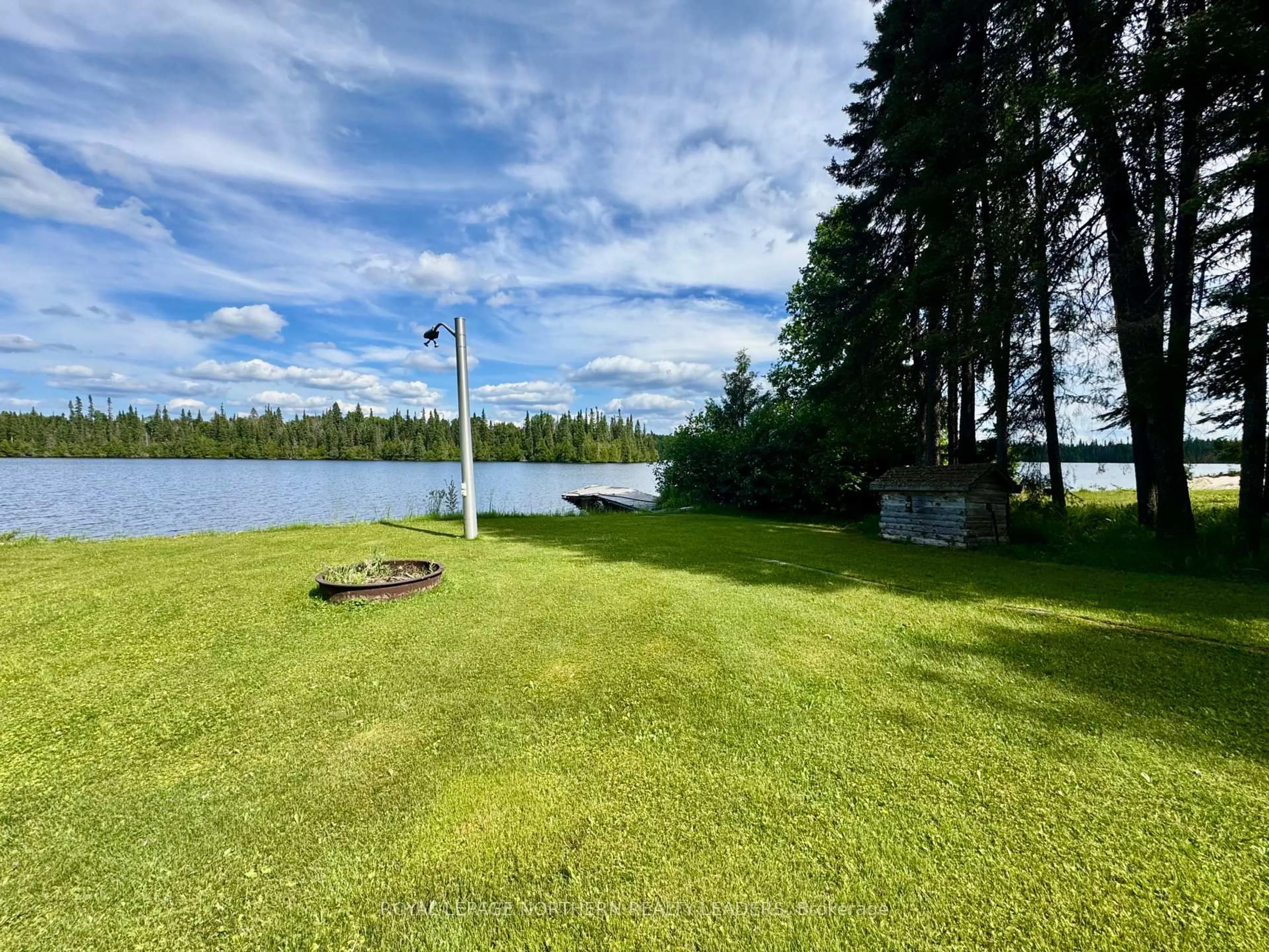 A pic from outside/outdoor area/front of a property/back of a property/a pic from drone, water/lake/river/ocean view for 10 Sewell Lake Rd, Timmins Ontario P4N 7K2
