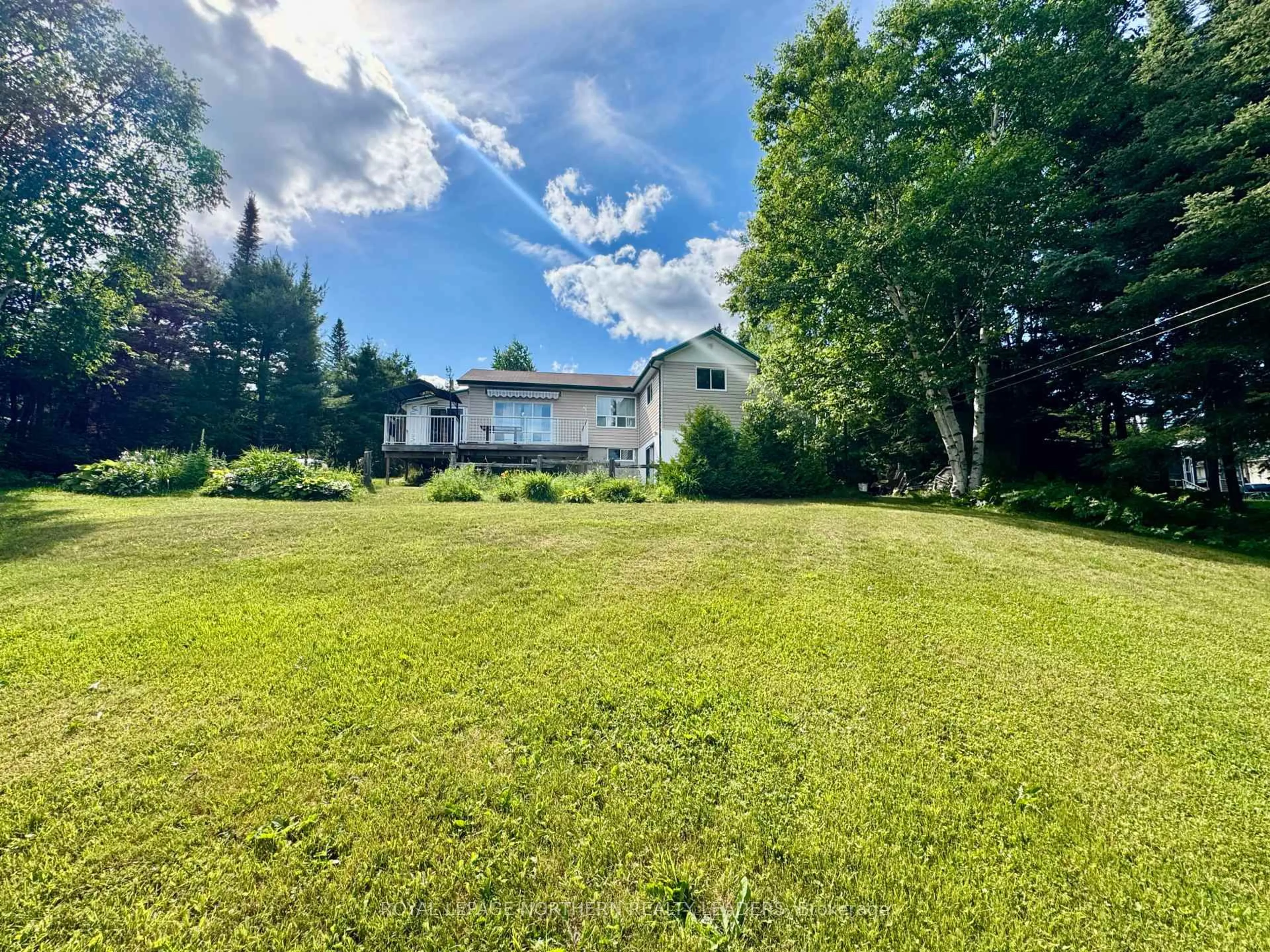 A pic from outside/outdoor area/front of a property/back of a property/a pic from drone, water/lake/river/ocean view for 10 Sewell Lake Rd, Timmins Ontario P4N 7K2