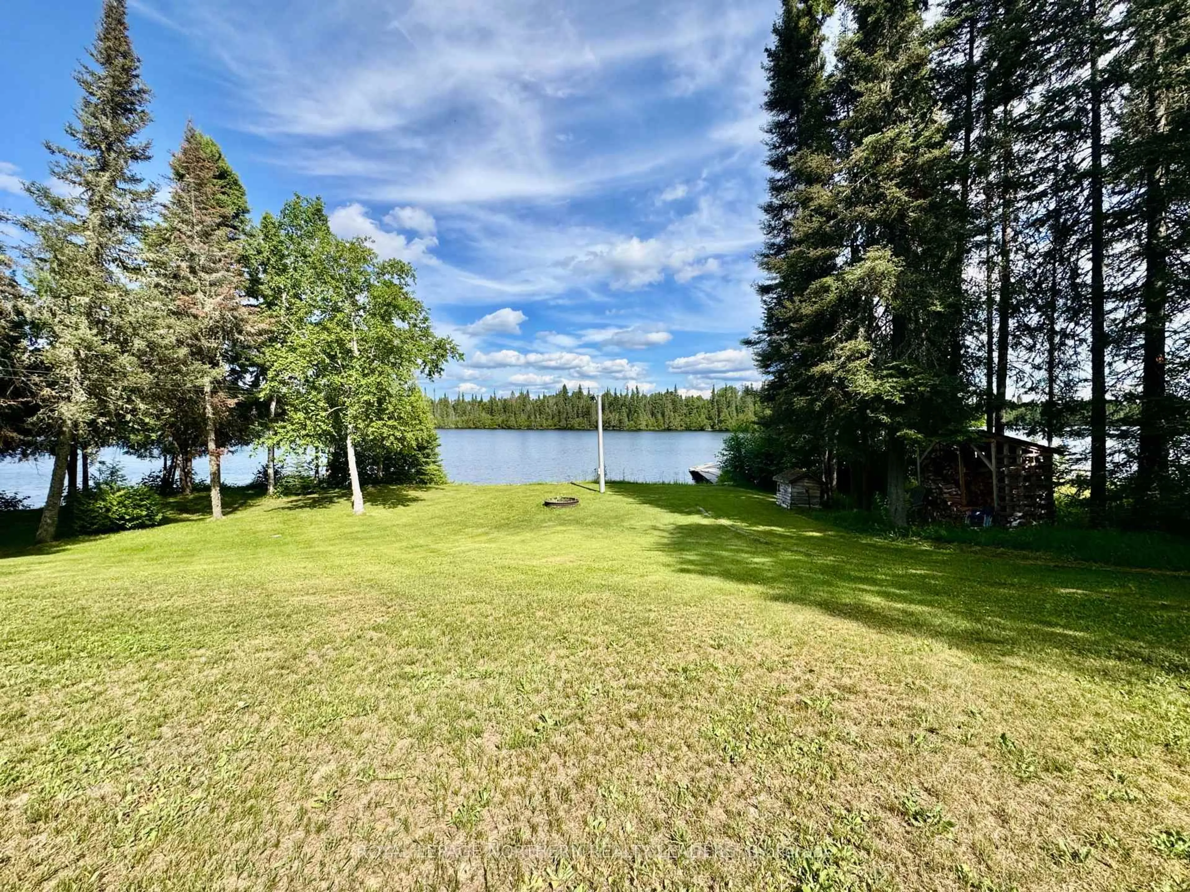 A pic from outside/outdoor area/front of a property/back of a property/a pic from drone, water/lake/river/ocean view for 10 Sewell Lake Rd, Timmins Ontario P4N 7K2
