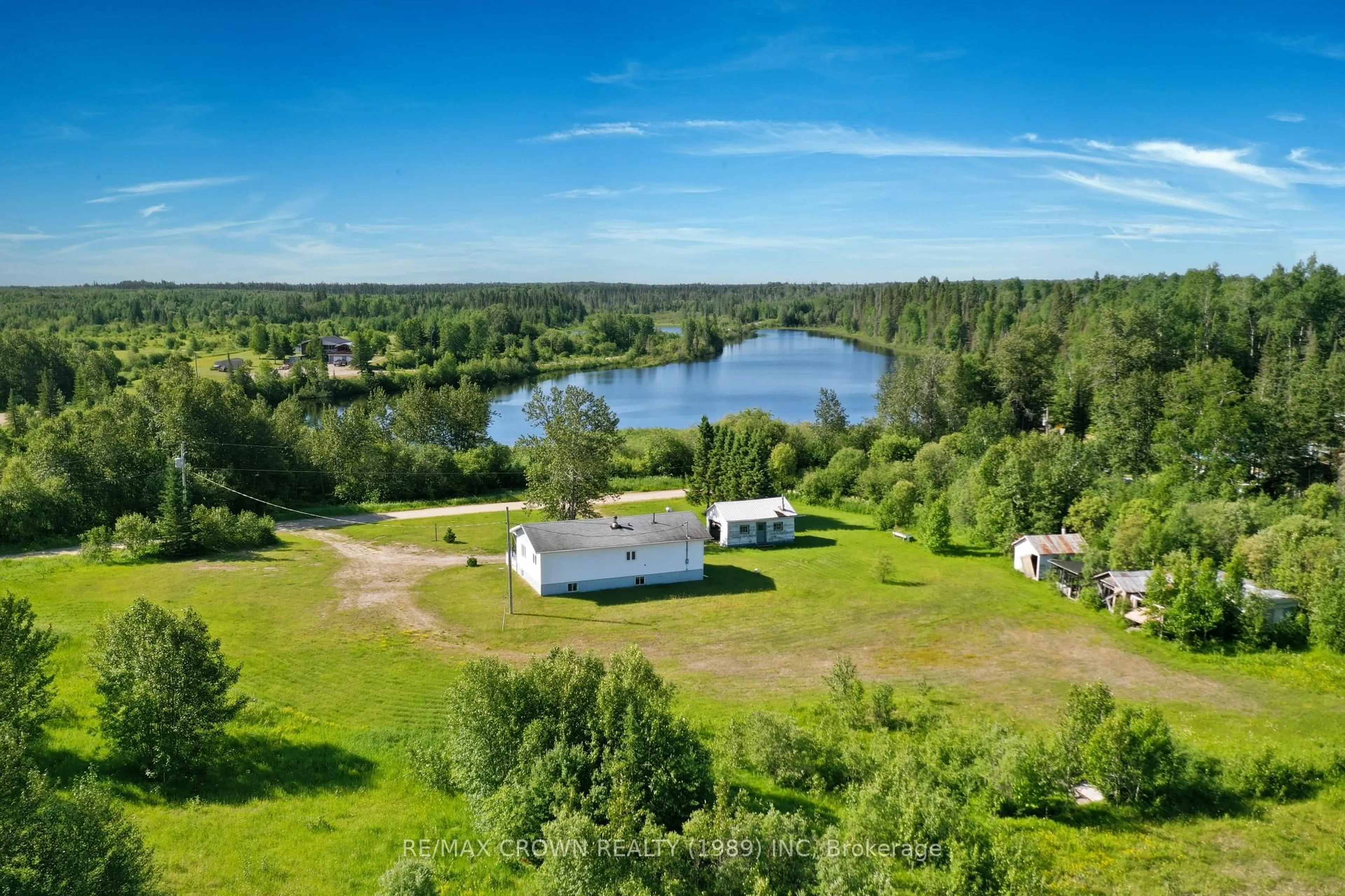A pic from outside/outdoor area/front of a property/back of a property/a pic from drone, water/lake/river/ocean view for 45A Chain Of Lakes Rd #Moonbeam, Kapuskasing Ontario P0L 1V0