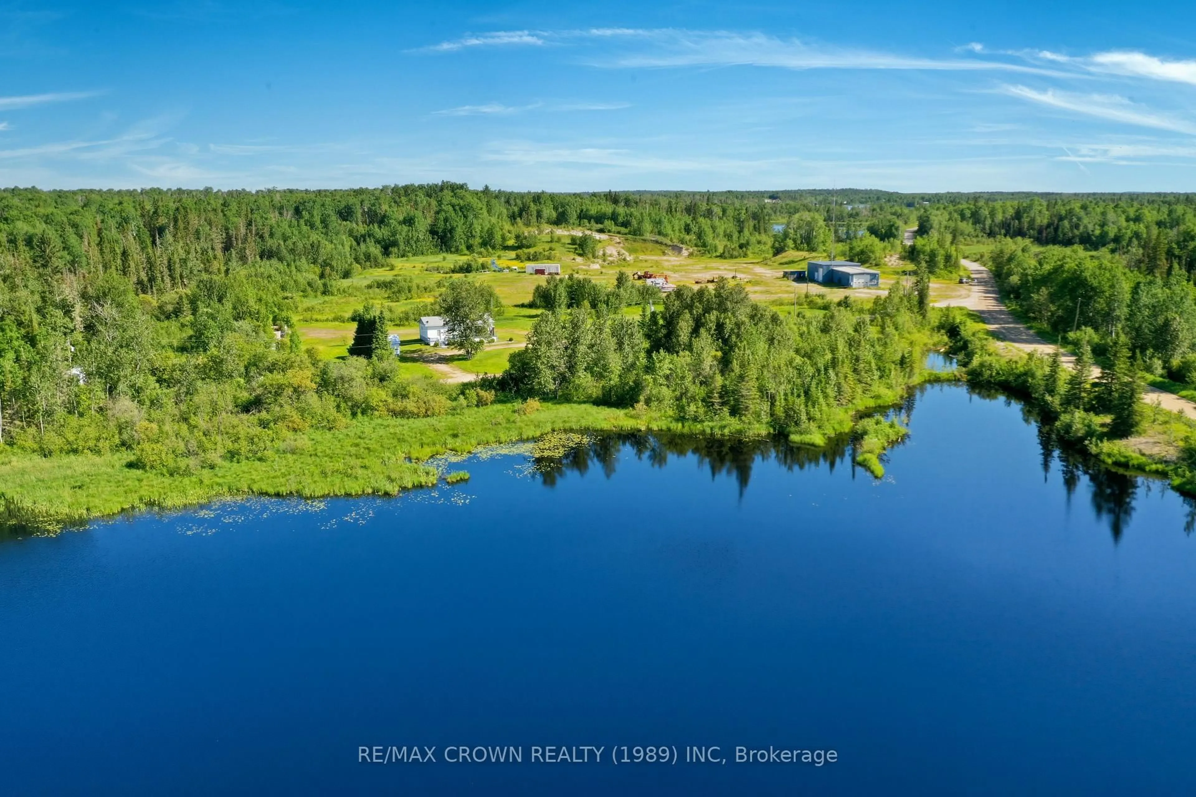 A pic from outside/outdoor area/front of a property/back of a property/a pic from drone, water/lake/river/ocean view for 45A Chain Of Lakes Rd #Moonbeam, Kapuskasing Ontario P0L 1V0