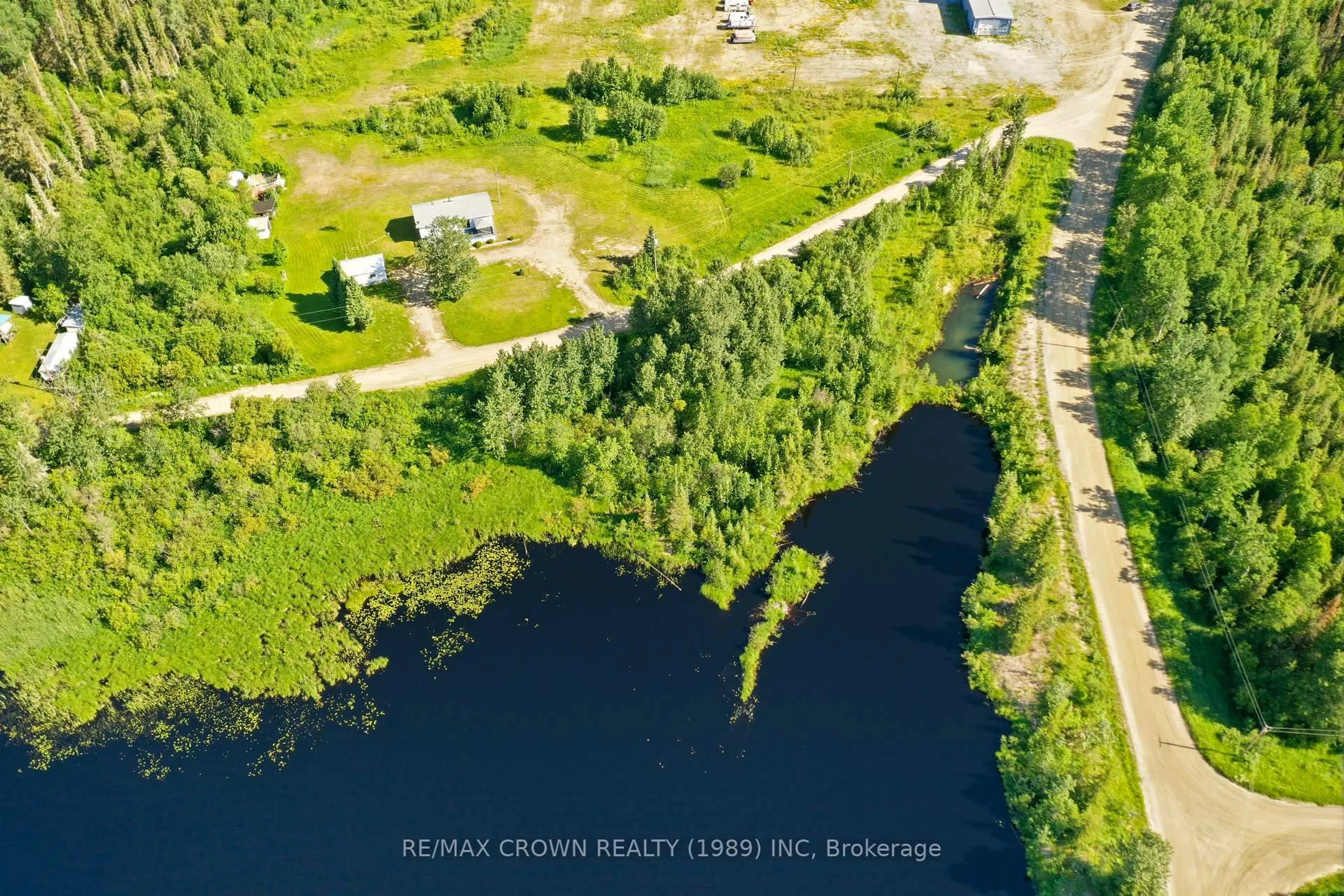 A pic from outside/outdoor area/front of a property/back of a property/a pic from drone, water/lake/river/ocean view for 45A Chain Of Lakes Rd #Moonbeam, Kapuskasing Ontario P0L 1V0
