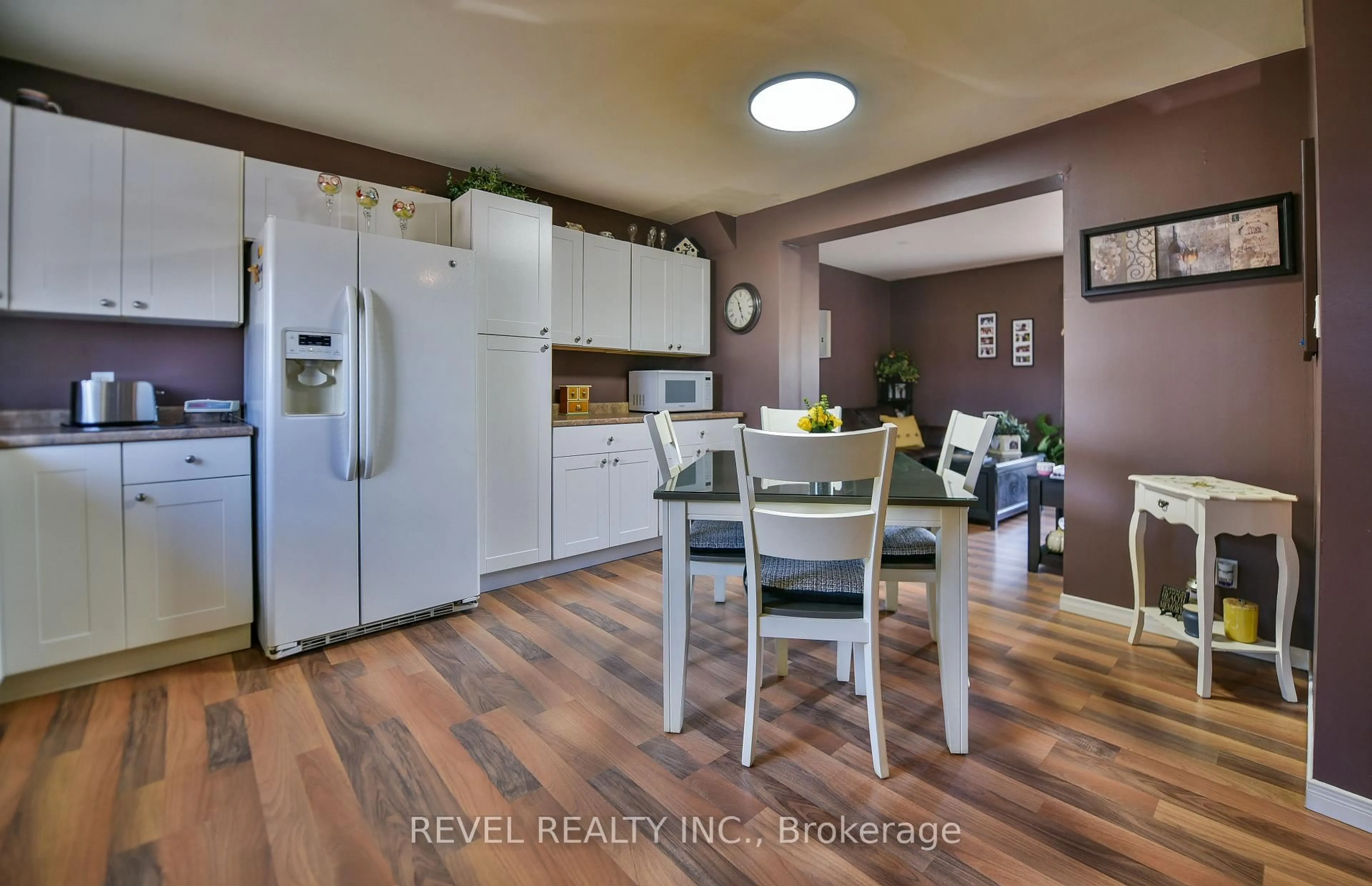 Open concept kitchen, wood/laminate floor for 537 College St #3, Timmins Ontario P4N 7Y9