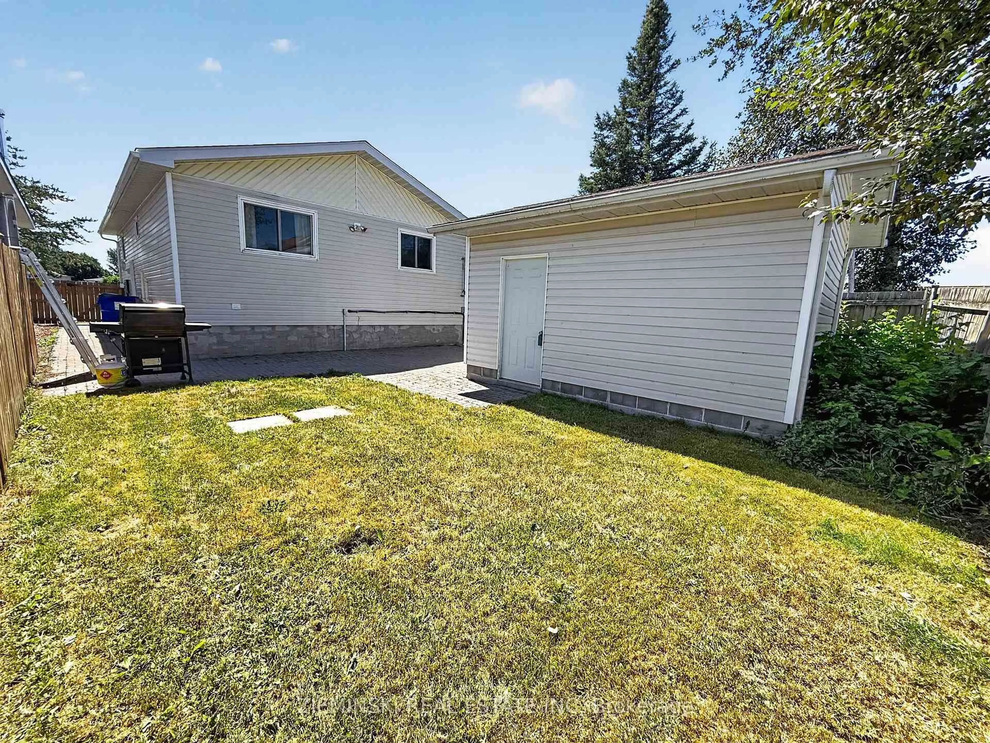 A pic from outside/outdoor area/front of a property/back of a property/a pic from drone, street for 1222 Gatineau Blvd, Timmins Ontario P4R 1E3
