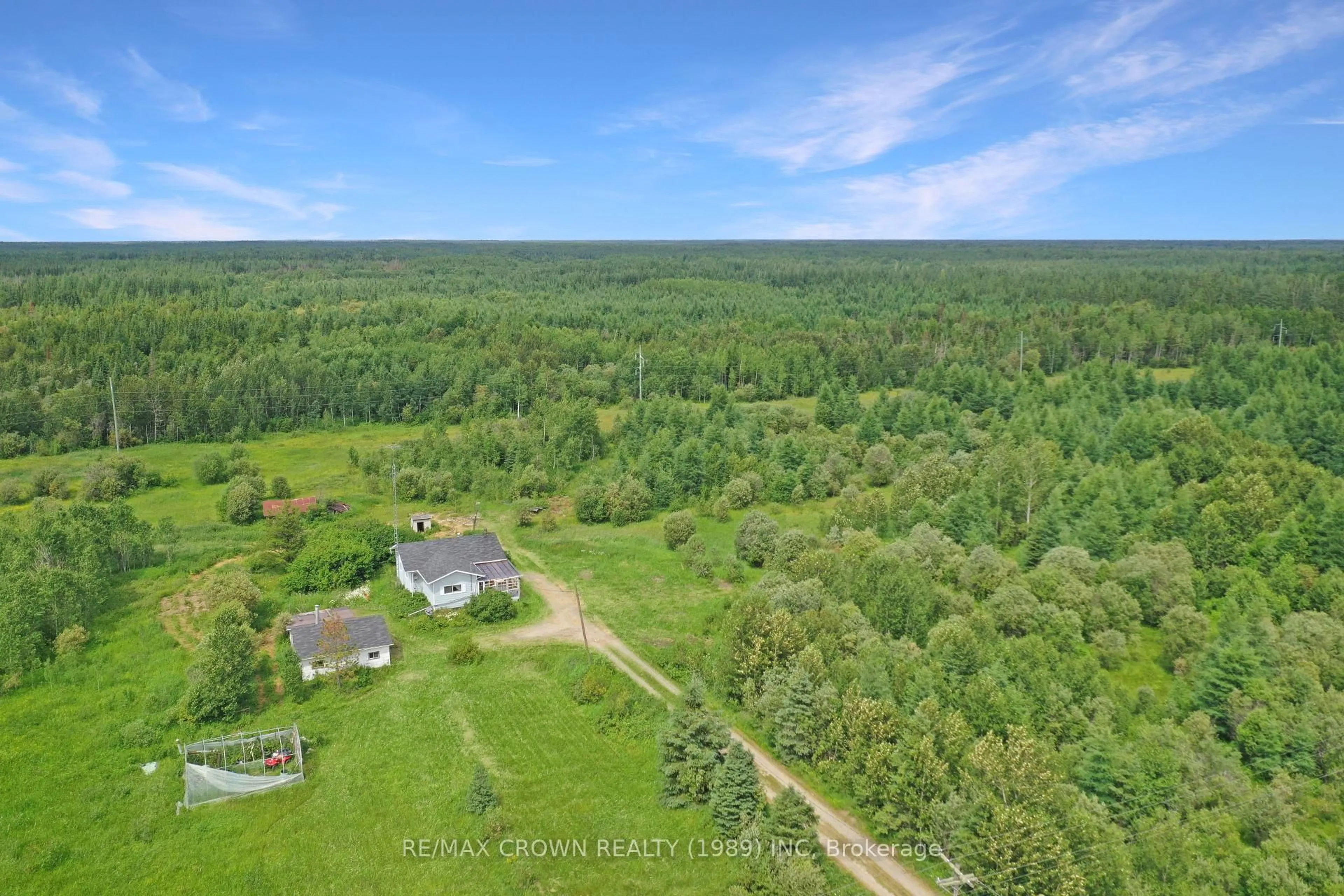 A pic from outside/outdoor area/front of a property/back of a property/a pic from drone, forest/trees view for 925 Highway 11 #Fauquier-Strickland, Smooth Rock Falls Ontario P0L 2C0