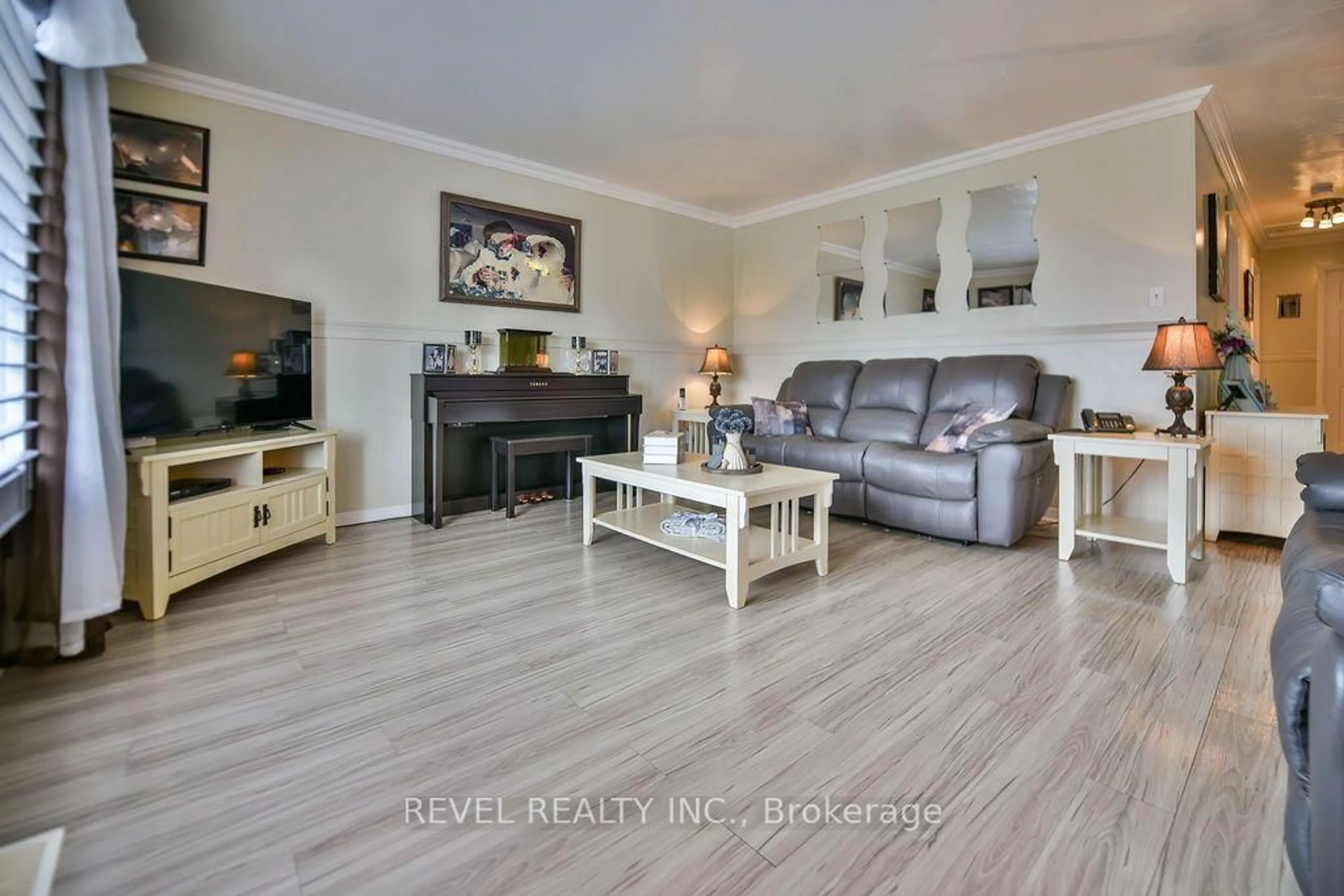Living room with furniture, wood/laminate floor for 216 Renee Pl, Timmins Ontario P4P 1E8