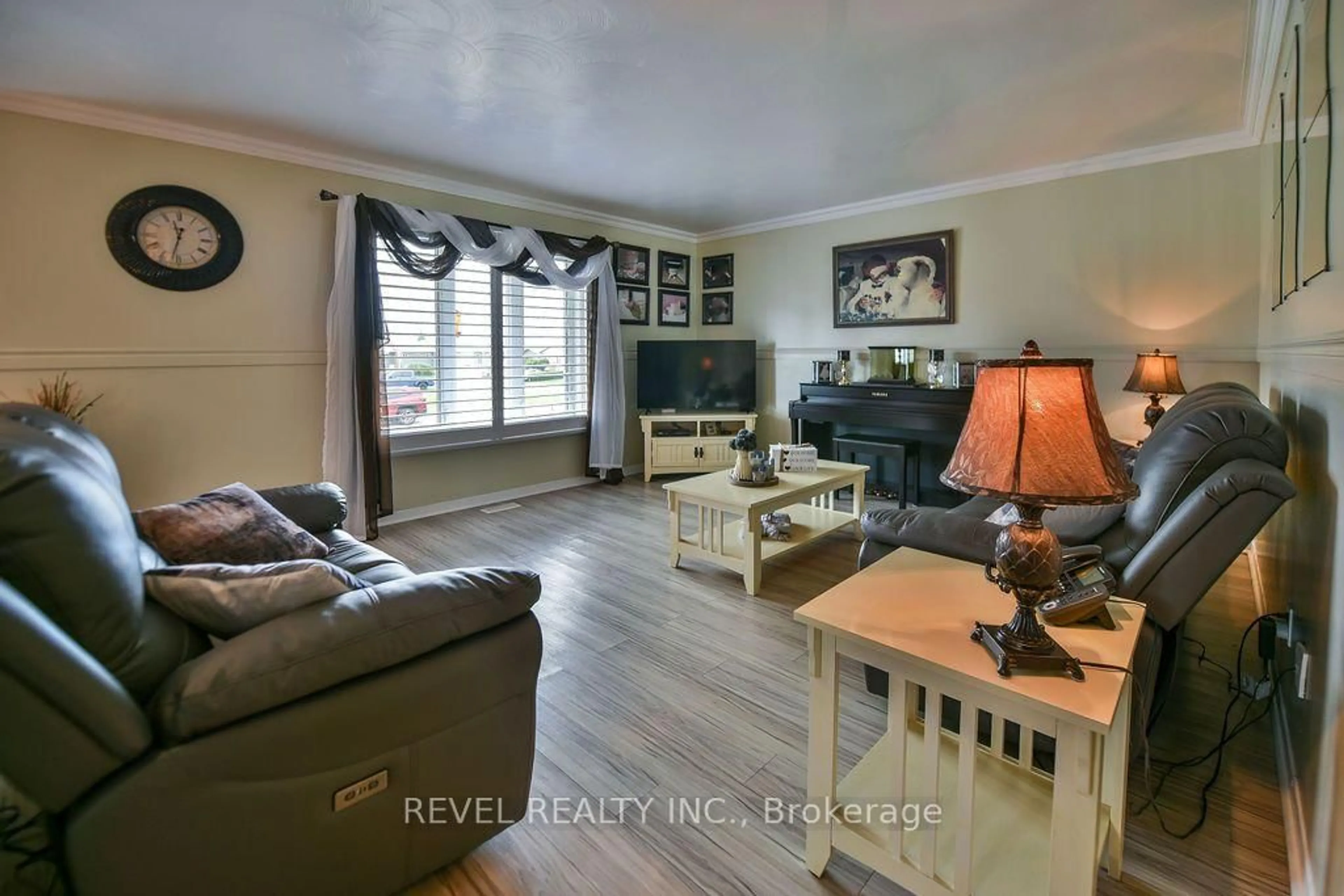 Living room with furniture, wood/laminate floor for 216 Renee Pl, Timmins Ontario P4P 1E8