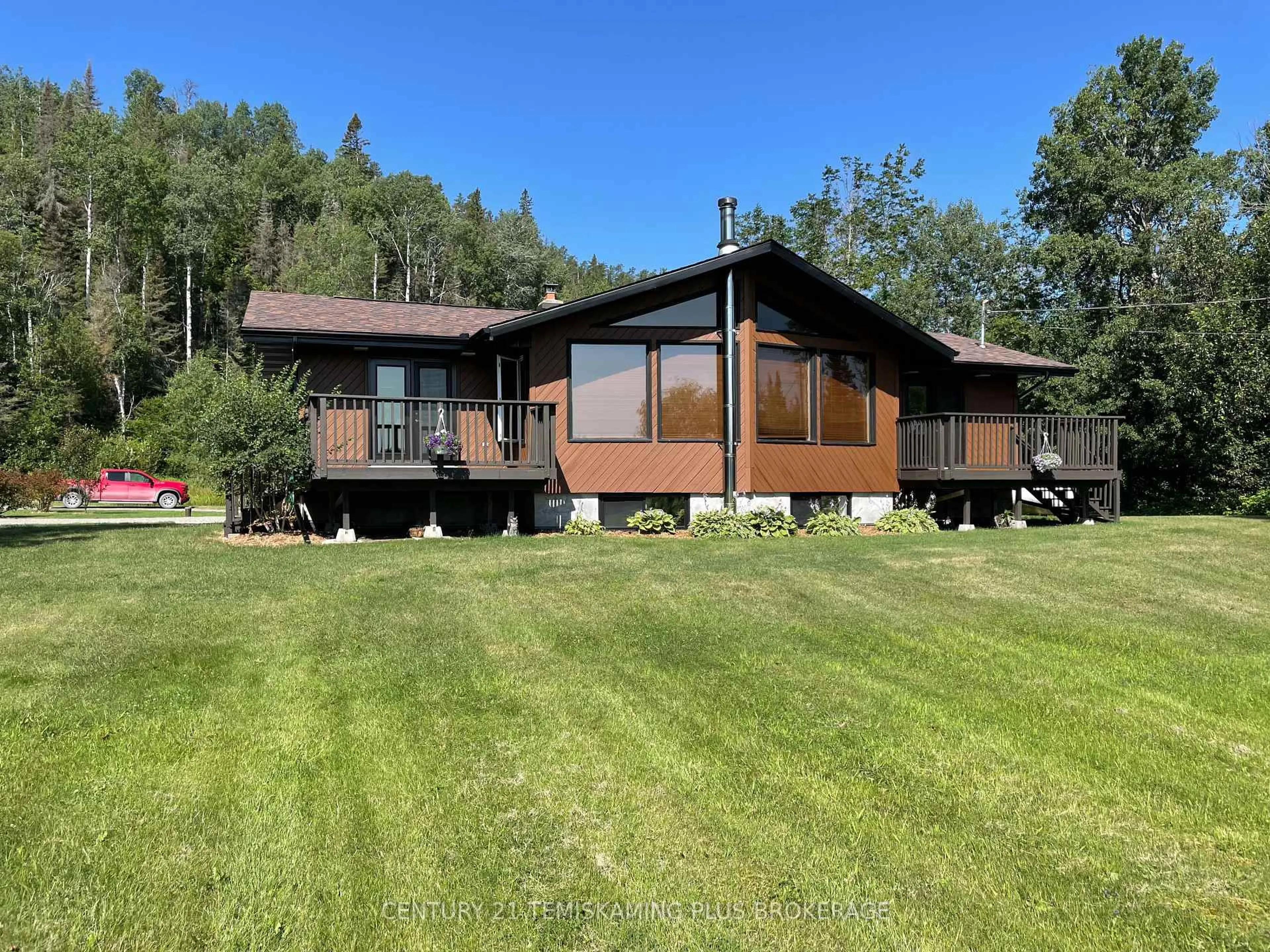 A pic from outside/outdoor area/front of a property/back of a property/a pic from drone, water/lake/river/ocean view for 805519 Hooper Rd, Timiskaming Ontario P0J 1P0
