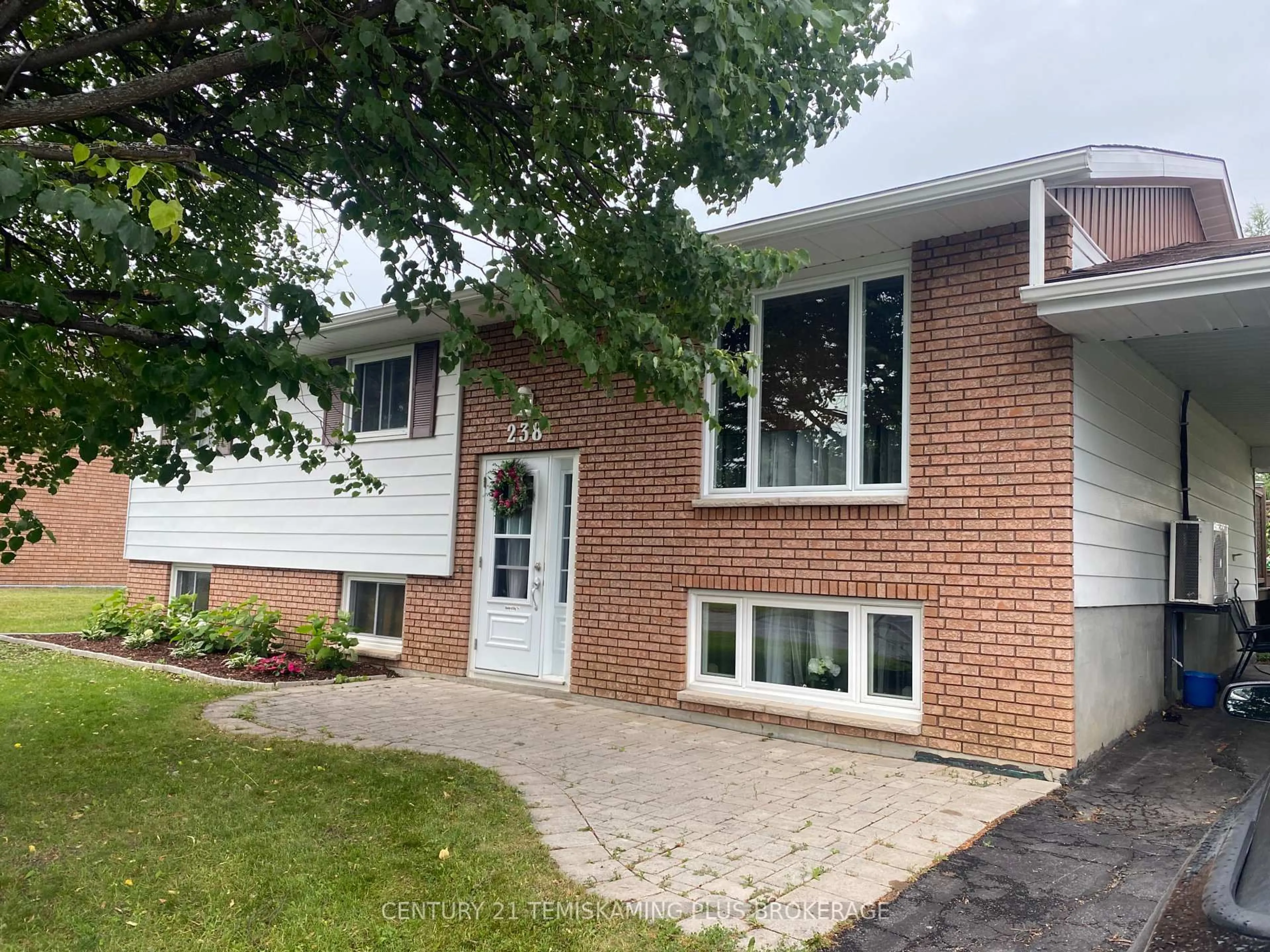 Home with brick exterior material, street for 238 RONDEAU Rd, Temiskaming Shores Ontario P0J 1P0
