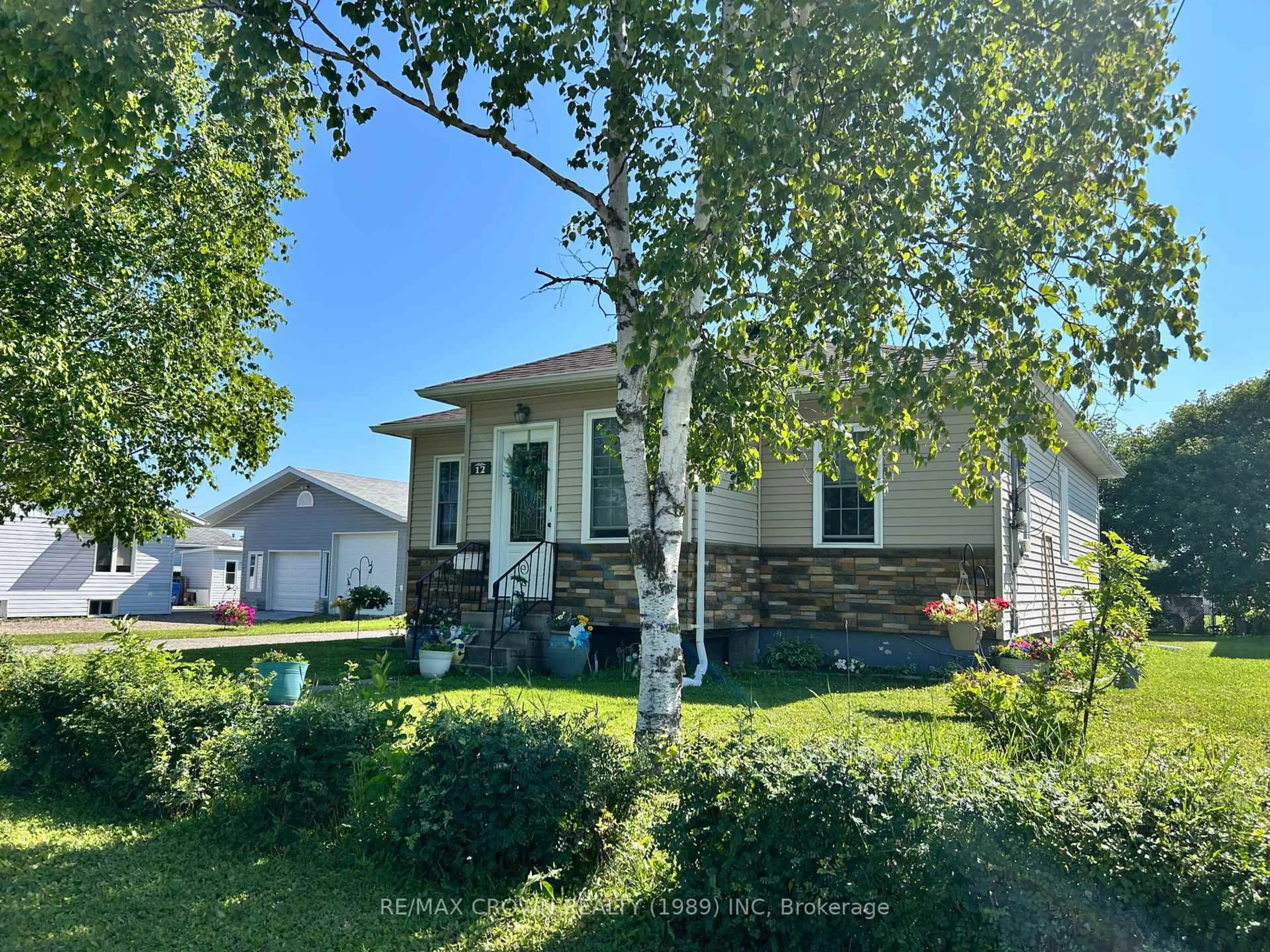 Home with vinyl exterior material, street for 12 Erickson Ave, Kapuskasing Ontario P5N 2K7