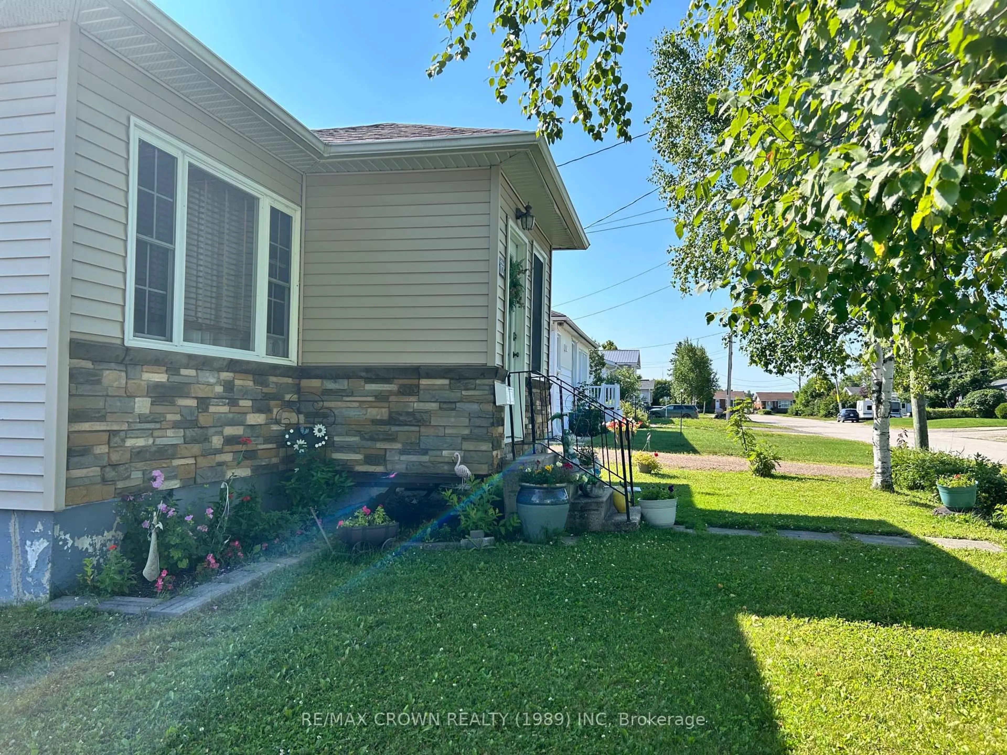 A pic from outside/outdoor area/front of a property/back of a property/a pic from drone, water/lake/river/ocean view for 12 Erickson Ave, Kapuskasing Ontario P5N 2K7