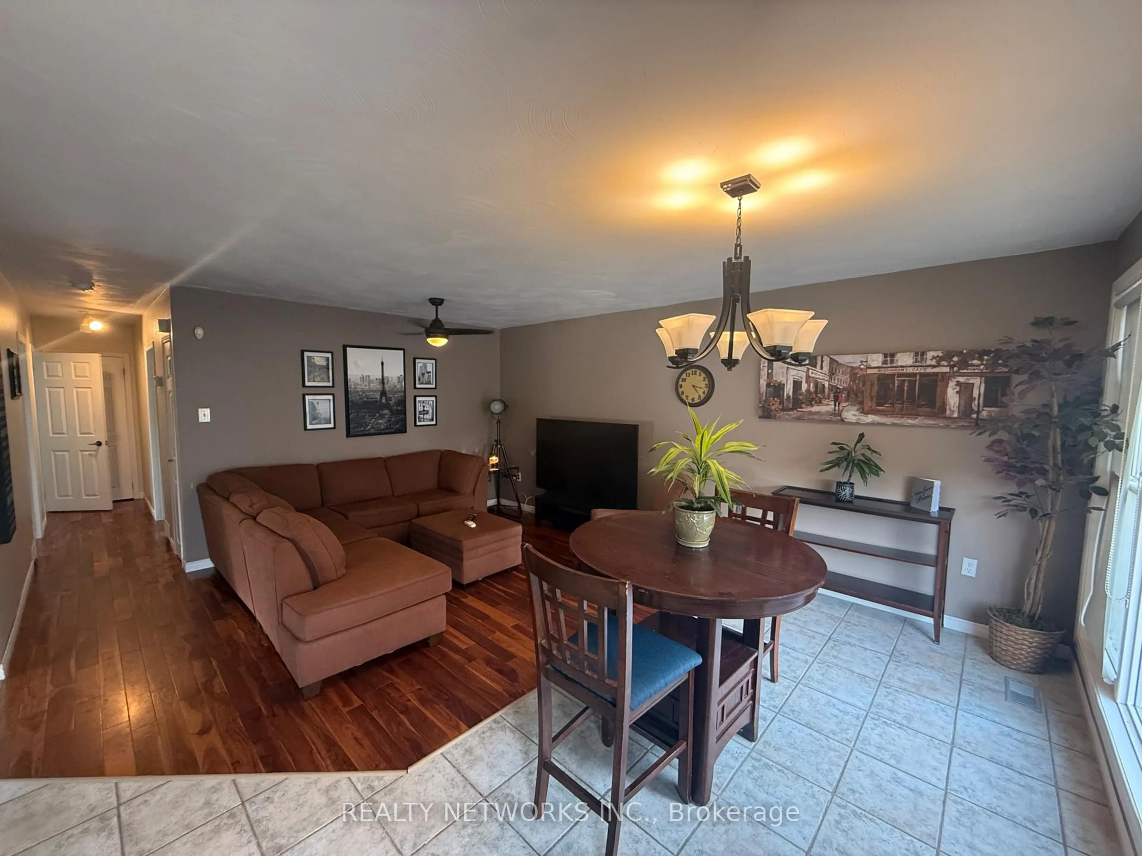 Living room with furniture, wood/laminate floor for 464 Hart St, Timmins Ontario P4N 6X4