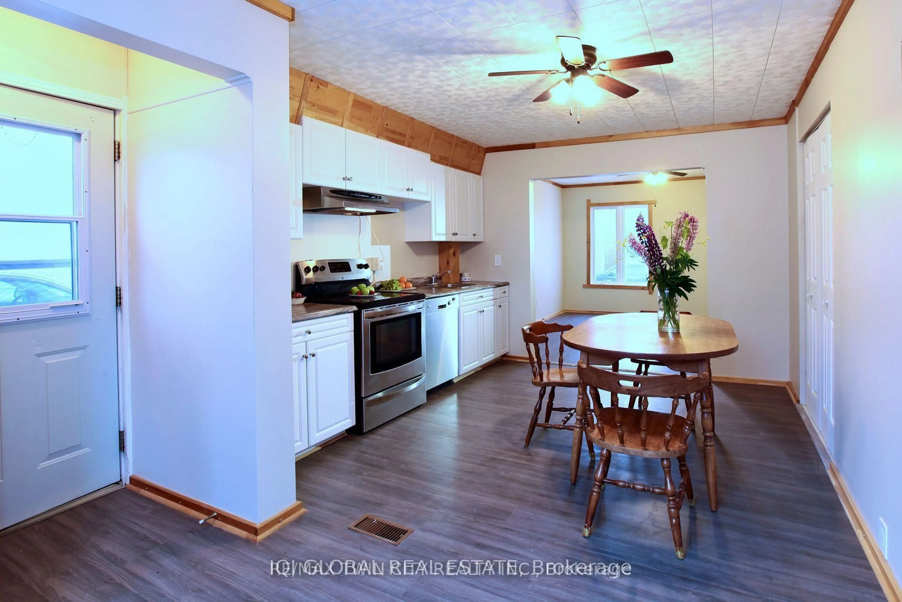 Open concept kitchen, wood/laminate floor for 33 McKelvie Ave, Kirkland Lake Ontario P2N 2K3