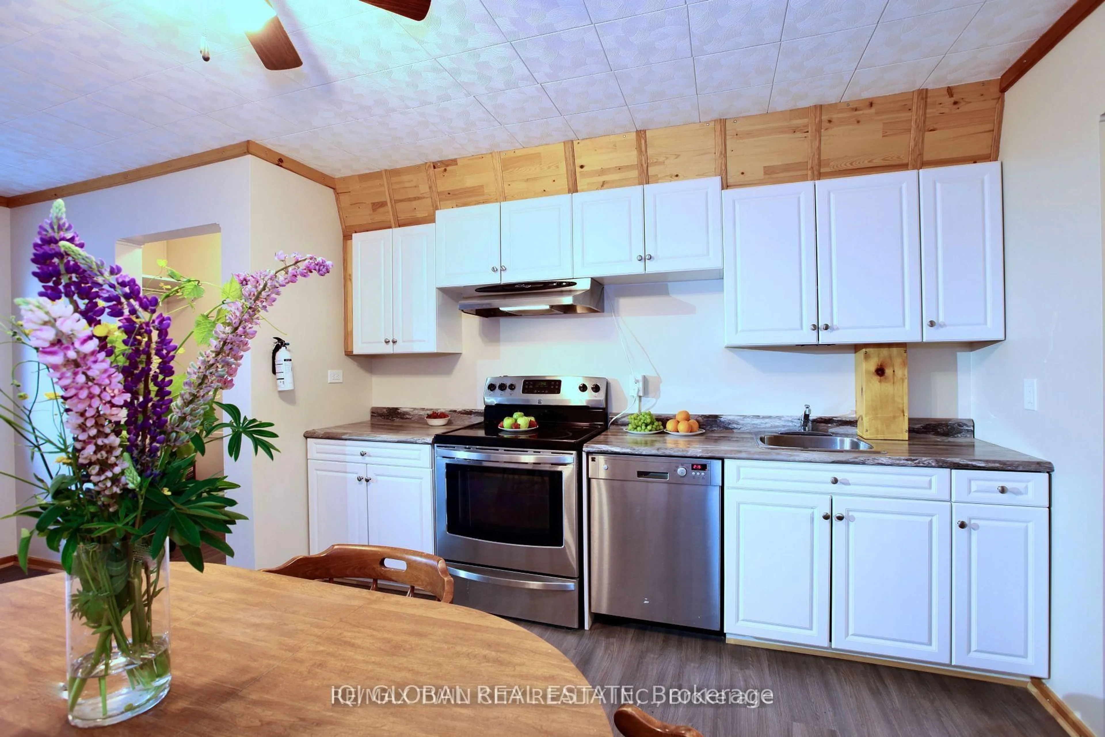 Open concept kitchen, wood/laminate floor for 33 McKelvie Ave, Kirkland Lake Ontario P2N 2K3