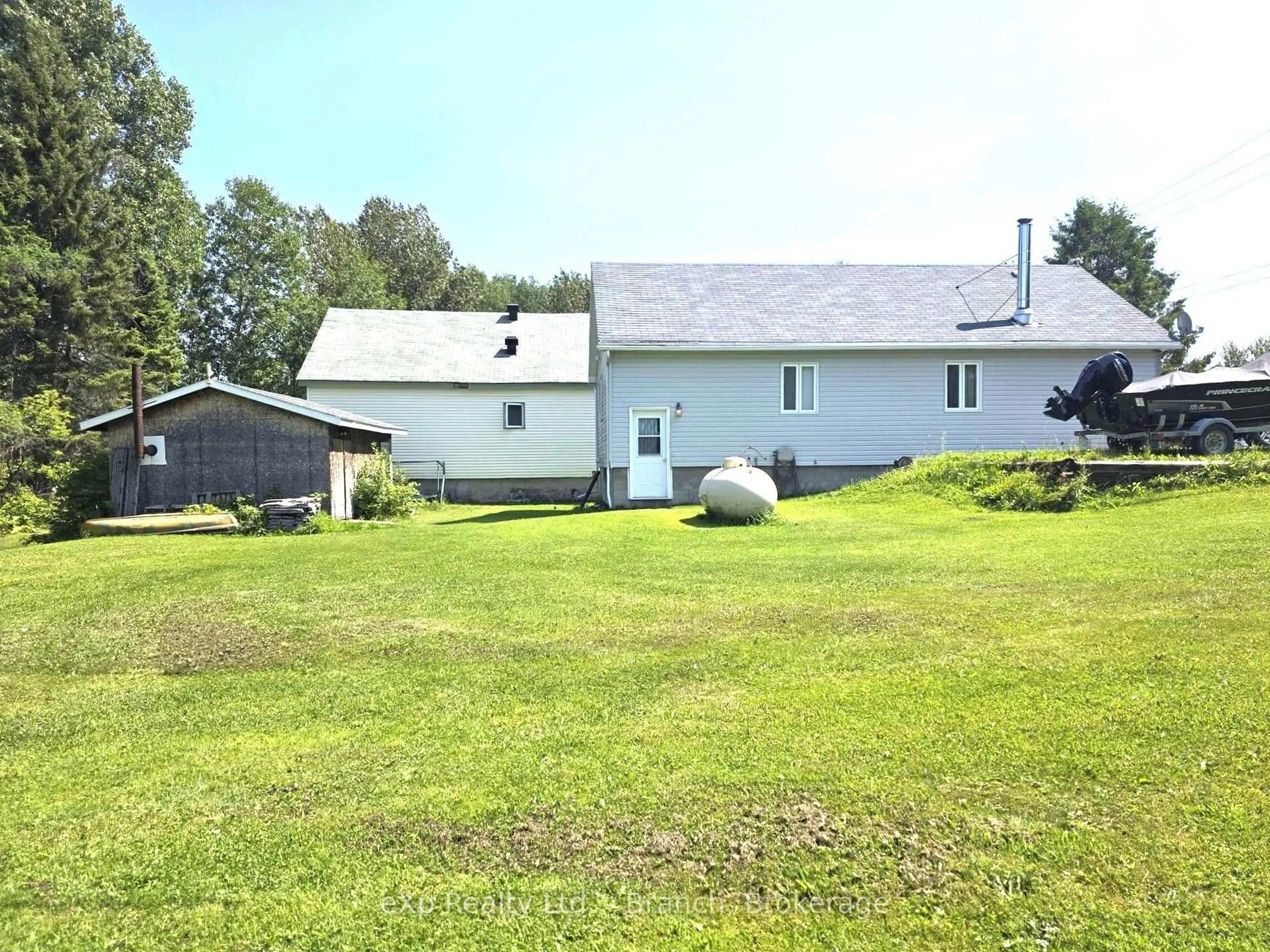 A pic from outside/outdoor area/front of a property/back of a property/a pic from drone, unknown for 34 Third Ave, Kirkland Lake Ontario P0K 1L0