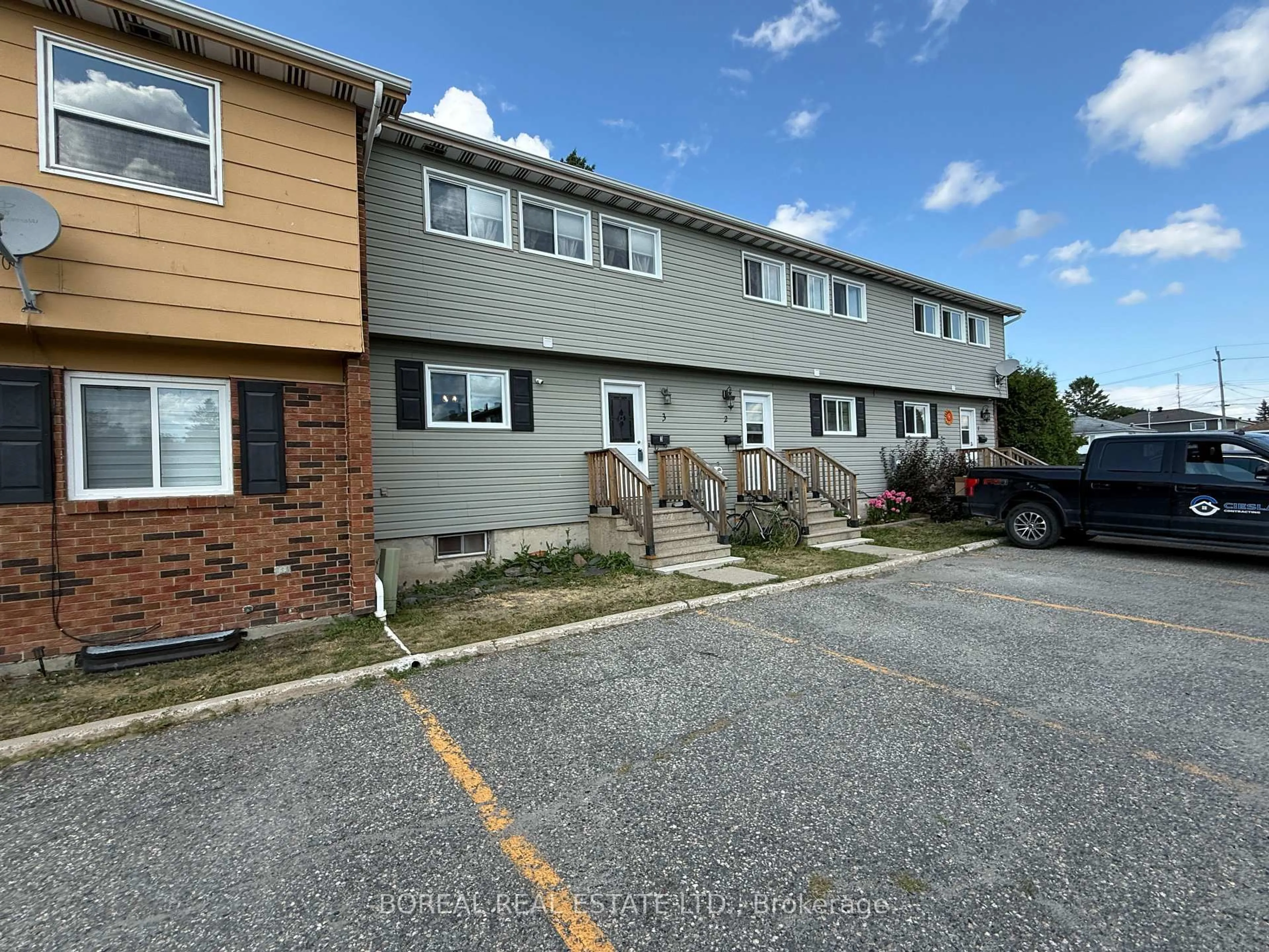 A pic from outside/outdoor area/front of a property/back of a property/a pic from drone, street for 577 College St #3, Timmins Ontario P4N 7Y9