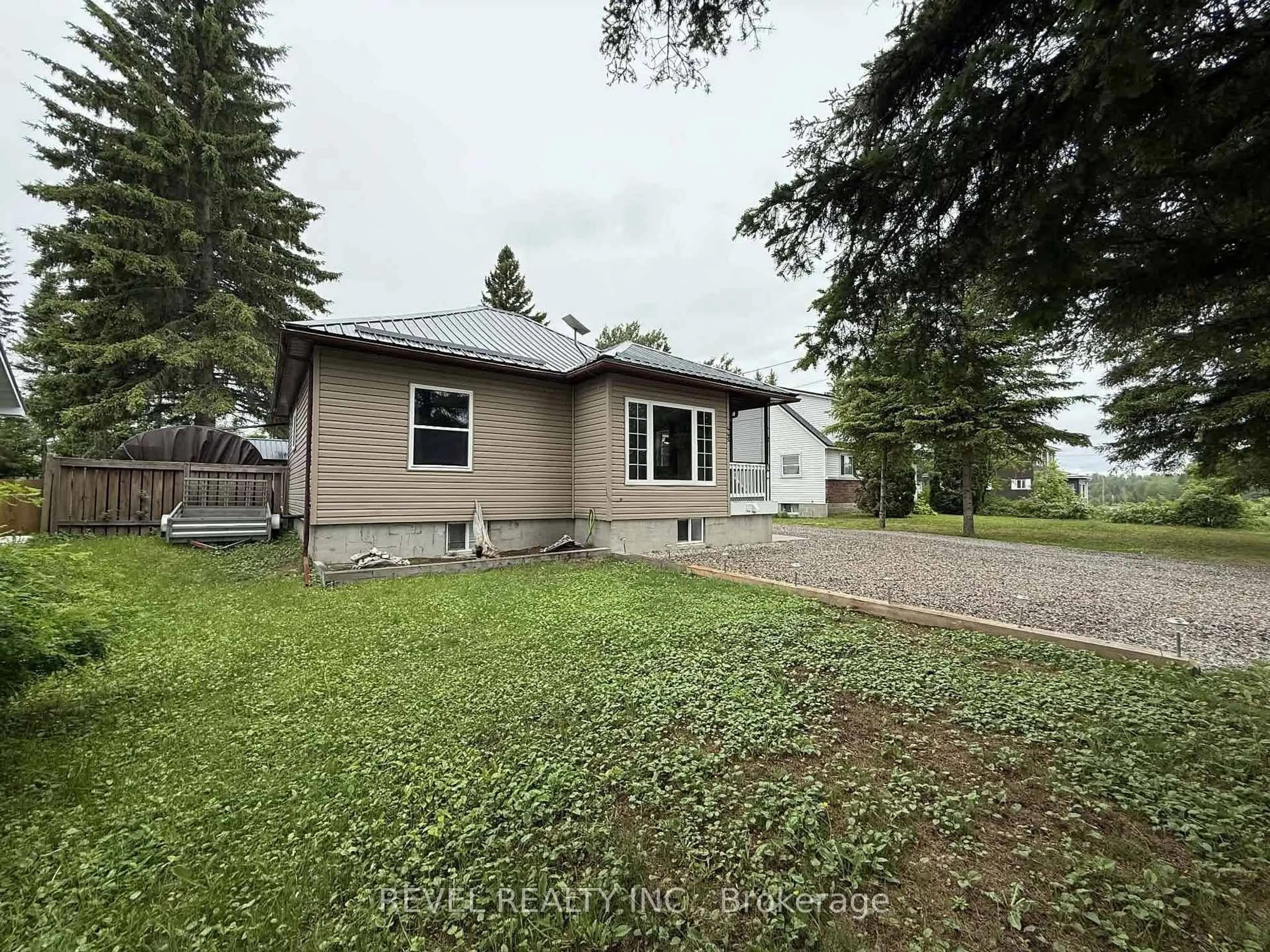 A pic from outside/outdoor area/front of a property/back of a property/a pic from drone, water/lake/river/ocean view for 445 Fourth Ave, Black River-Matheson Ontario P0K 1N0