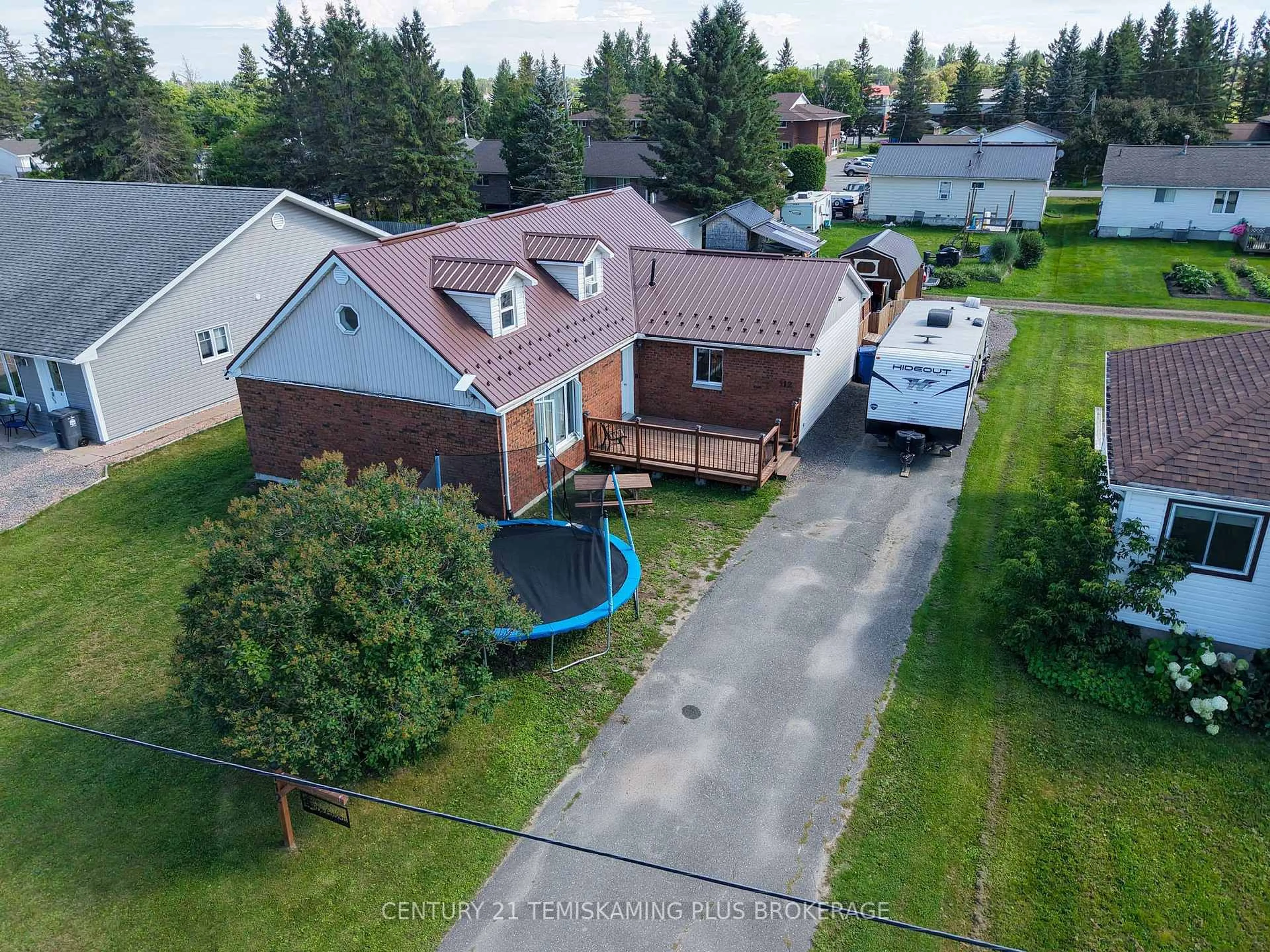 A pic from outside/outdoor area/front of a property/back of a property/a pic from drone, street for 112 4th Ave, Englehart Ontario P0J 1H0