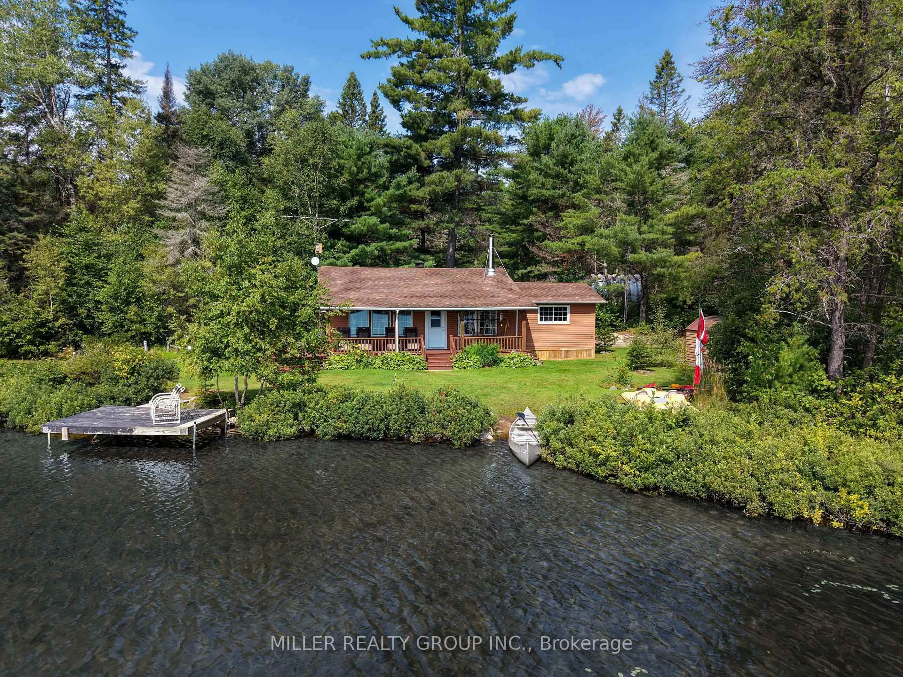 A pic from outside/outdoor area/front of a property/back of a property/a pic from drone, water/lake/river/ocean view for 7122 Twin Lakes Rd C-3 Rd, Timiskaming Ontario P0J 1P0