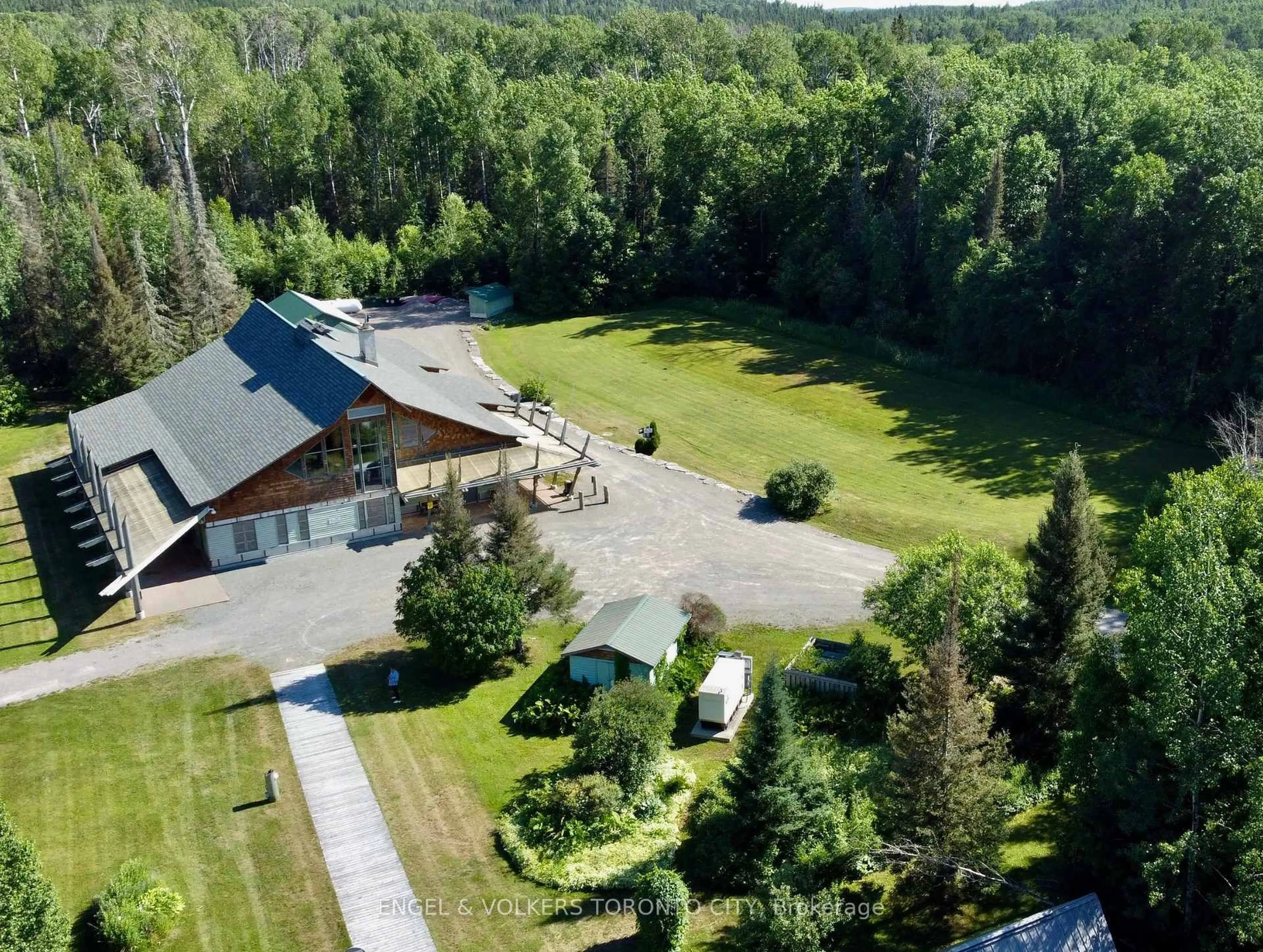 A pic from outside/outdoor area/front of a property/back of a property/a pic from drone, mountain view for 100 Ontario St, Timiskaming Ontario P0J 1G0