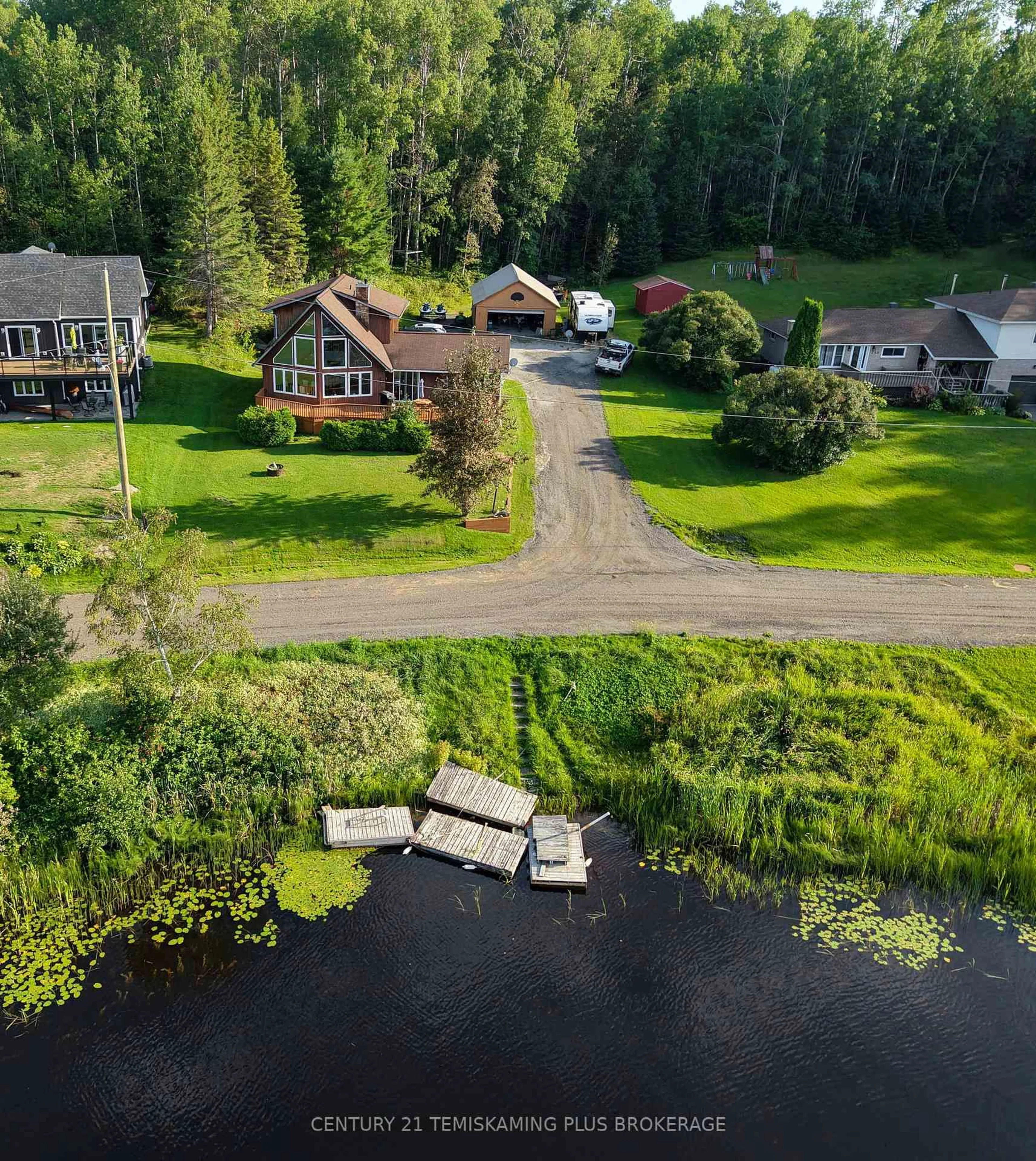 A pic from outside/outdoor area/front of a property/back of a property/a pic from drone, water/lake/river/ocean view for 65 Lakeshore Ave, Englehart Ontario P0J 1B0
