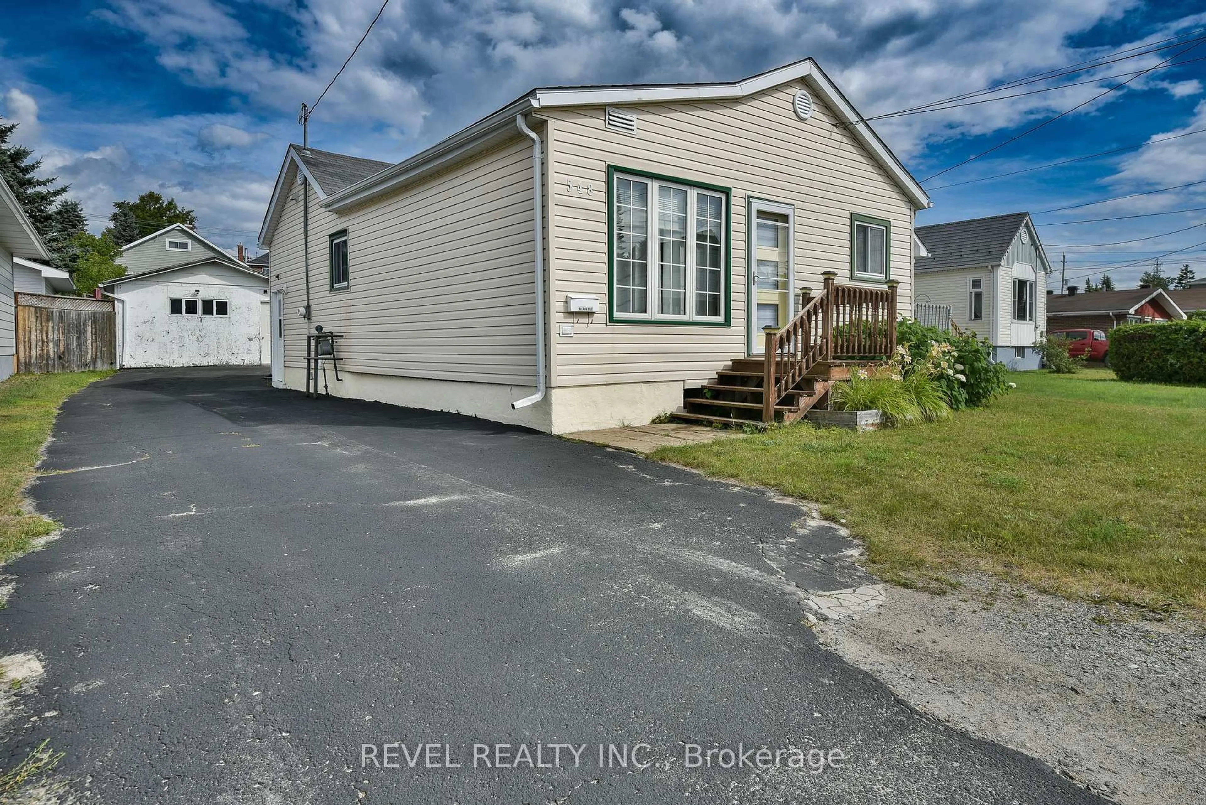 Home with vinyl exterior material, street for 548 Cedar St, Timmins Ontario P4N 2J5
