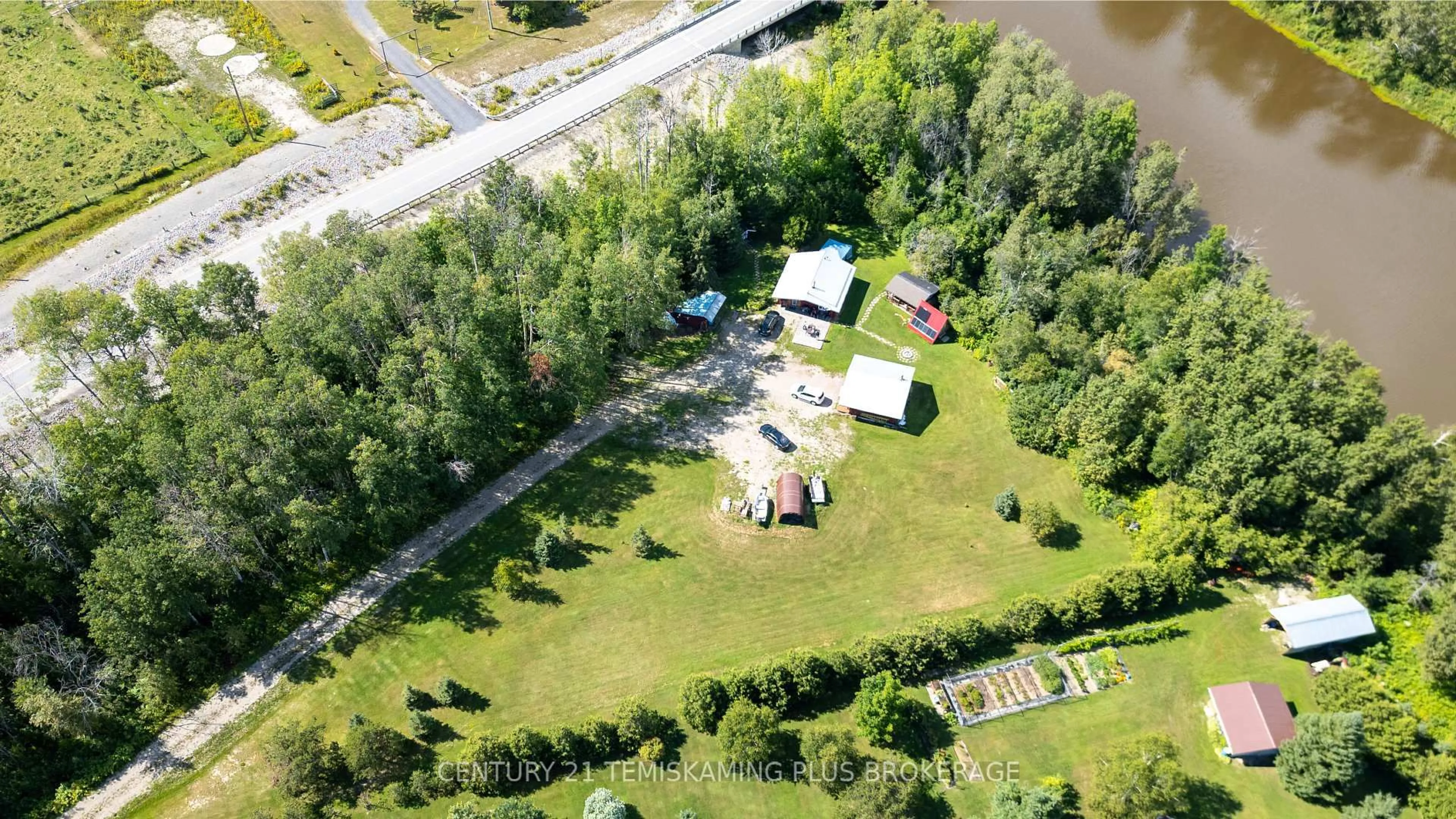 A pic from outside/outdoor area/front of a property/back of a property/a pic from drone, unknown for 951701 Highway 569, Timiskaming Ontario P0J 1L0
