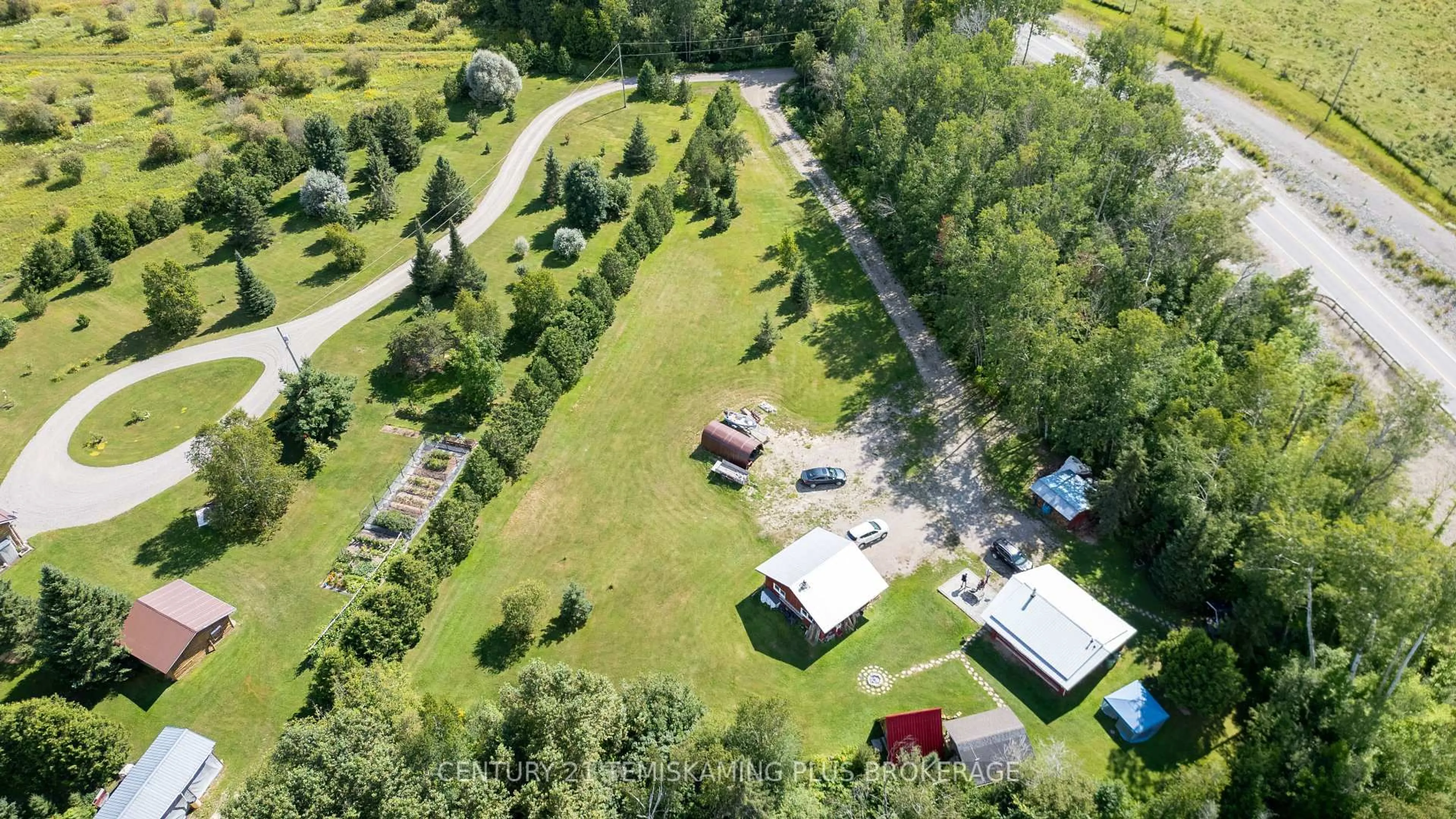 A pic from outside/outdoor area/front of a property/back of a property/a pic from drone, unknown for 951701 Highway 569, Timiskaming Ontario P0J 1L0