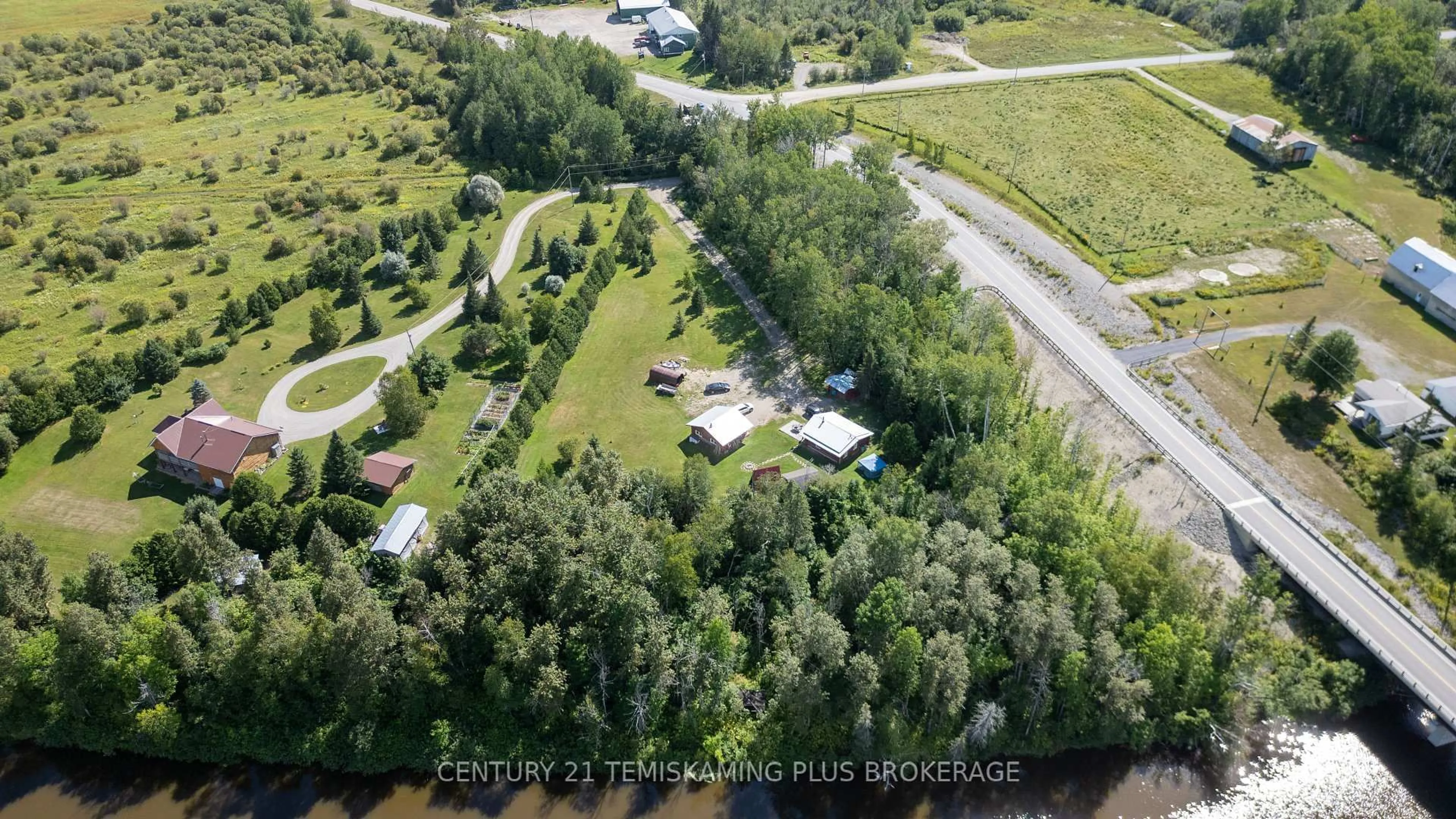 A pic from outside/outdoor area/front of a property/back of a property/a pic from drone, unknown for 951701 Highway 569, Timiskaming Ontario P0J 1L0