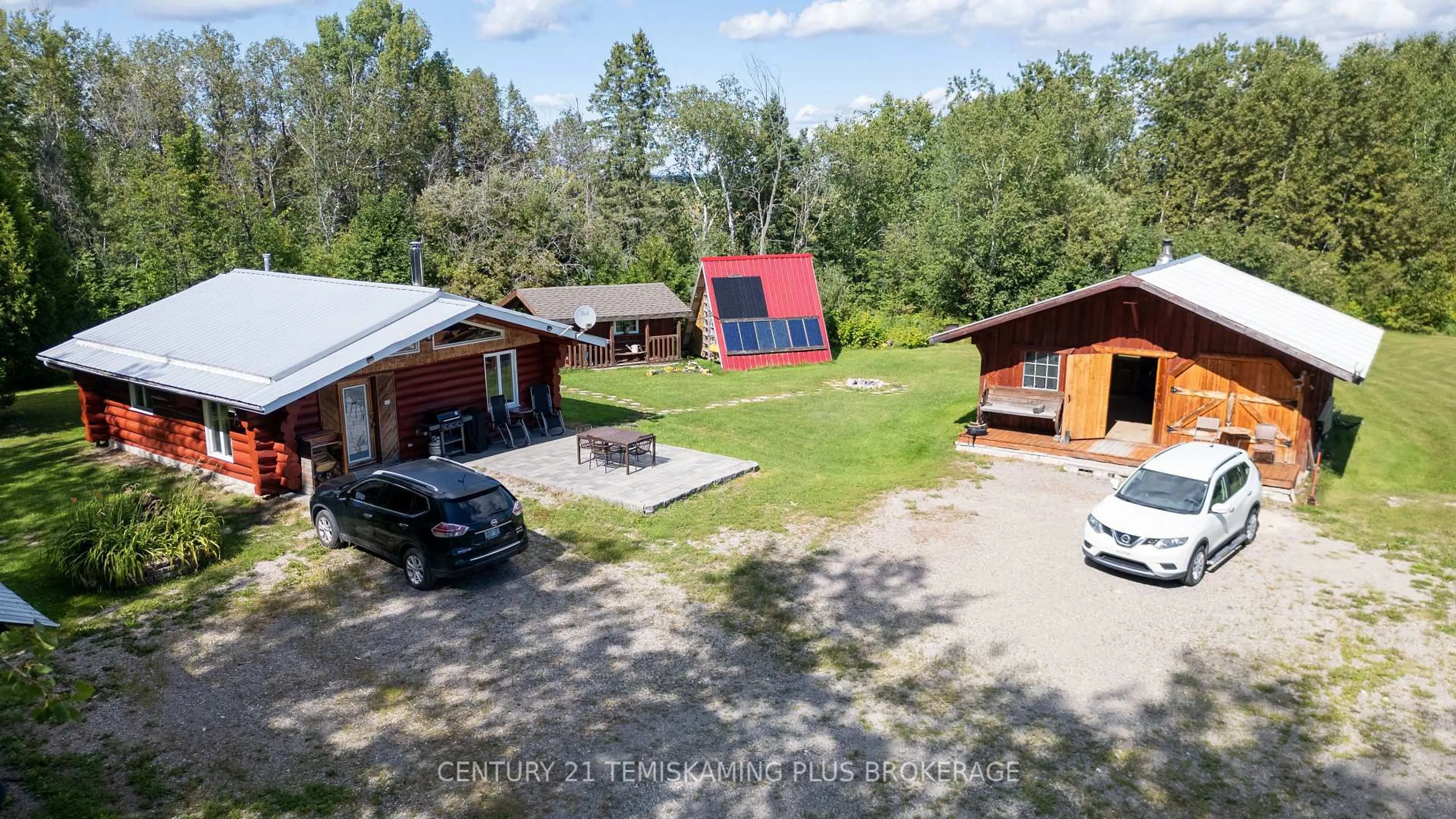 A pic from outside/outdoor area/front of a property/back of a property/a pic from drone, unknown for 951701 Highway 569, Timiskaming Ontario P0J 1L0