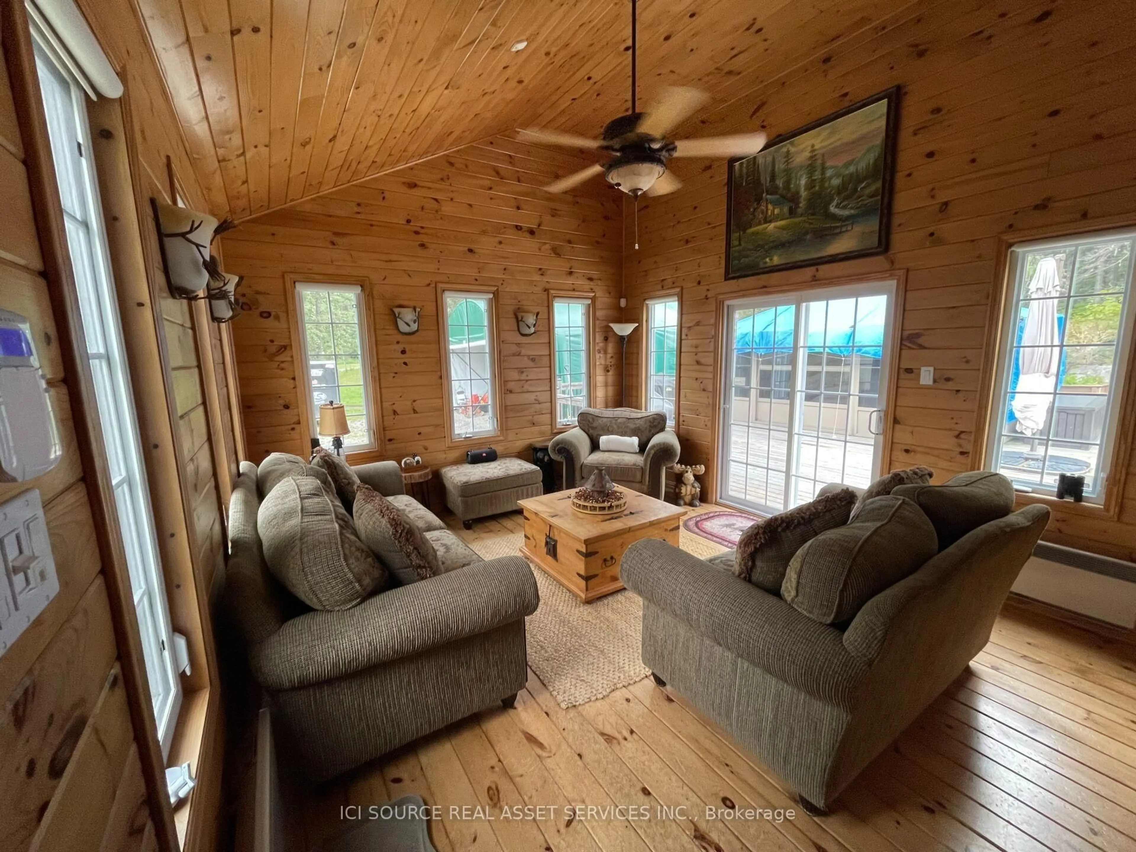 Living room with furniture, wood/laminate floor for 1186 Fantham Rd, Kapuskasing Ontario P0L 1G0