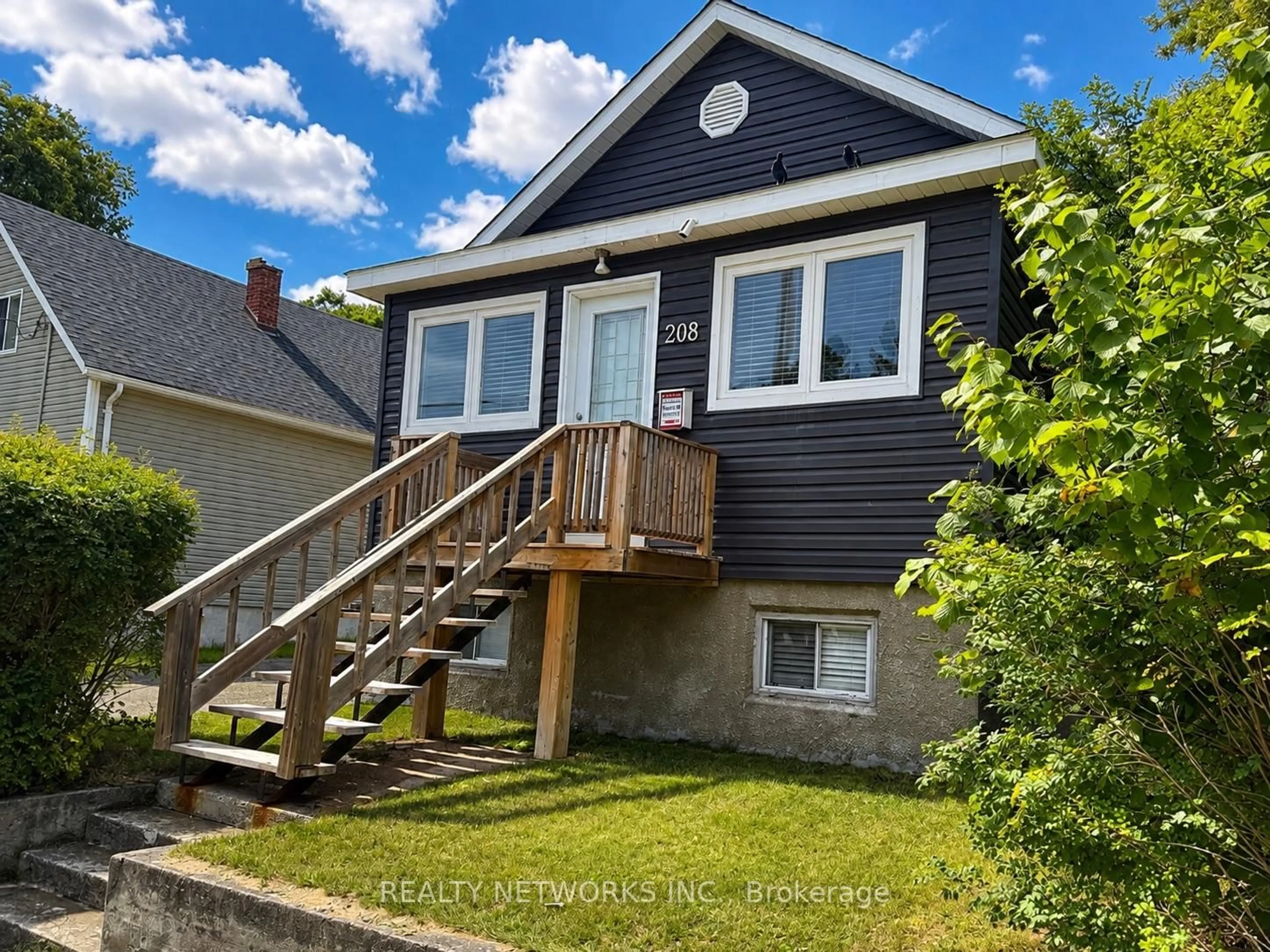 Home with vinyl exterior material, street for 208 Toke St, Timmins Ontario P4N 6V1