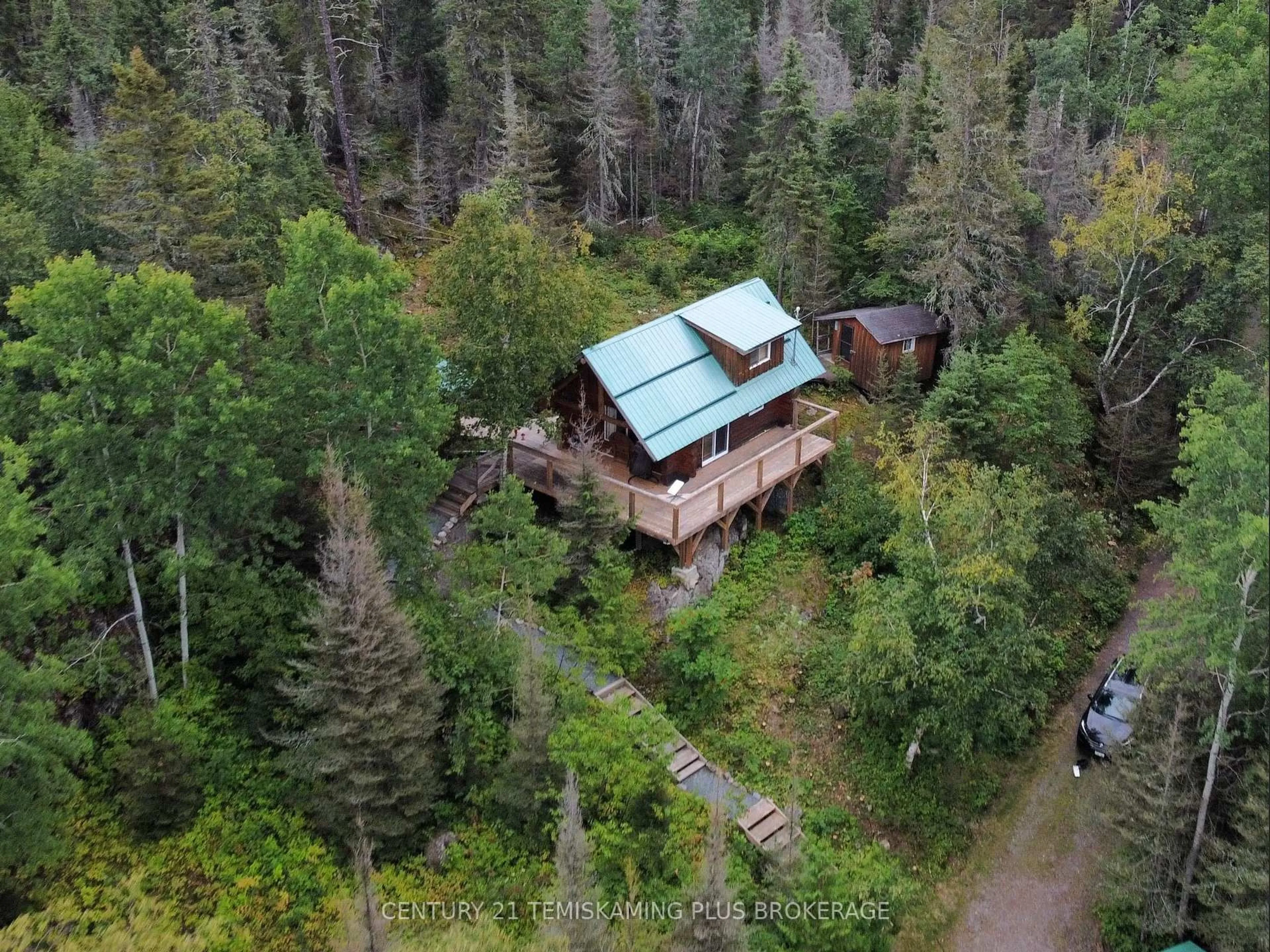 A pic from outside/outdoor area/front of a property/back of a property/a pic from drone, forest/trees view for 320 Shallow Bay Rd, Kirkland Lake Ontario P0K 1T0