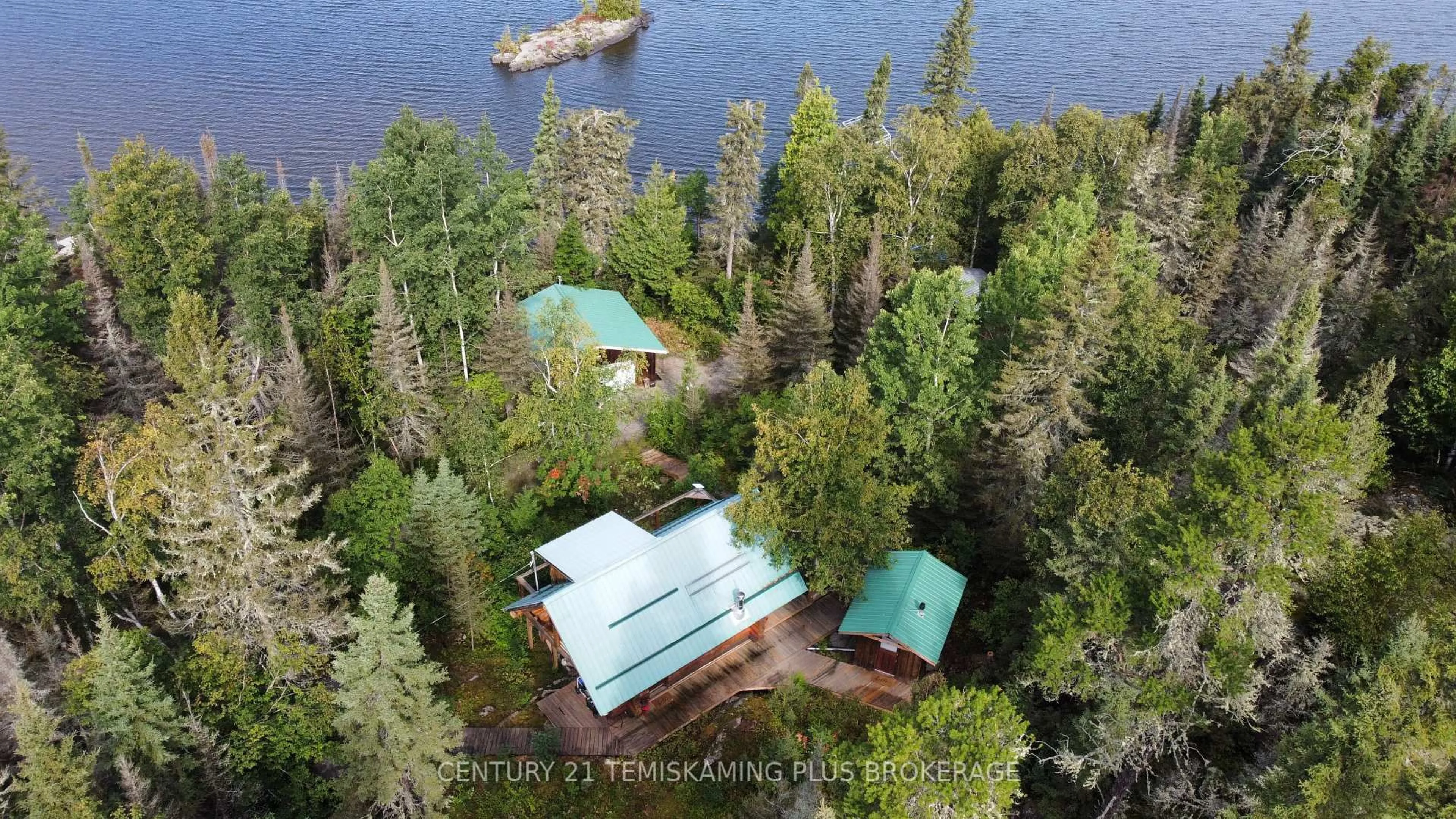 A pic from outside/outdoor area/front of a property/back of a property/a pic from drone, water/lake/river/ocean view for 320 Shallow Bay Rd, Kirkland Lake Ontario P0K 1T0