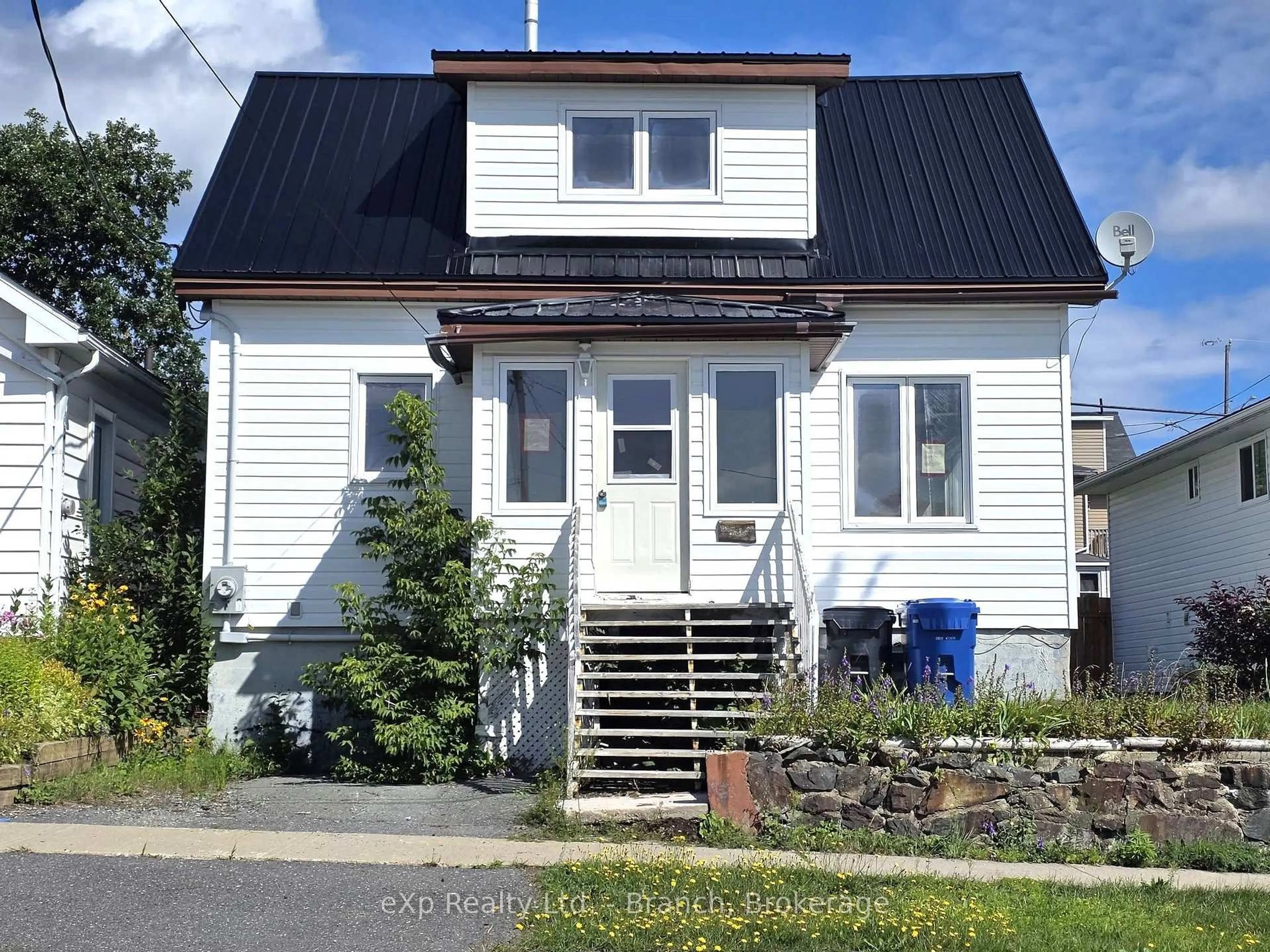 Home with vinyl exterior material, street for 14 Taylor Ave, Kirkland Lake Ontario P2N 2L1