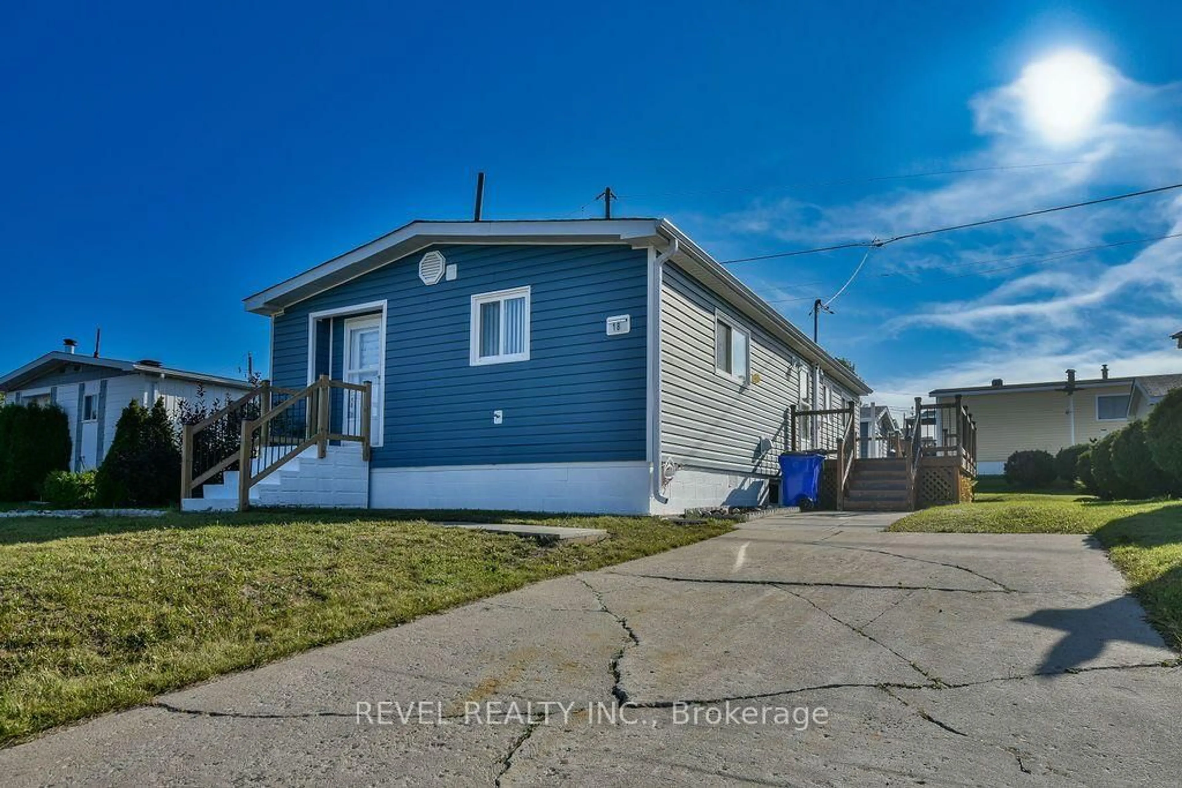 Home with vinyl exterior material, street for 18 Grasslands Rd, Timmins Ontario P4N 8R9