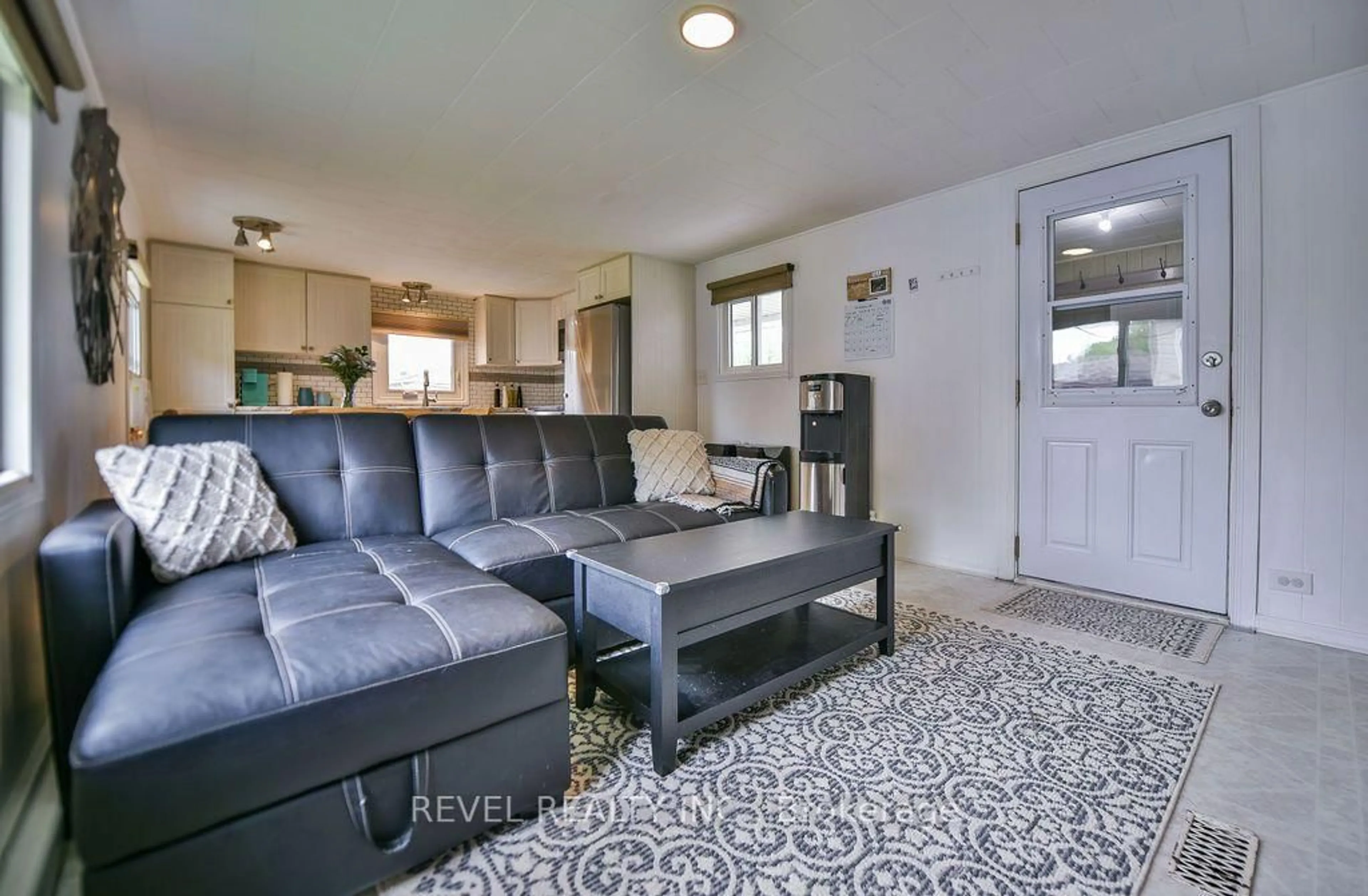 Living room with furniture, ceramic/tile floor for 30 Notre Dame, Timmins Ontario P4R 0C9